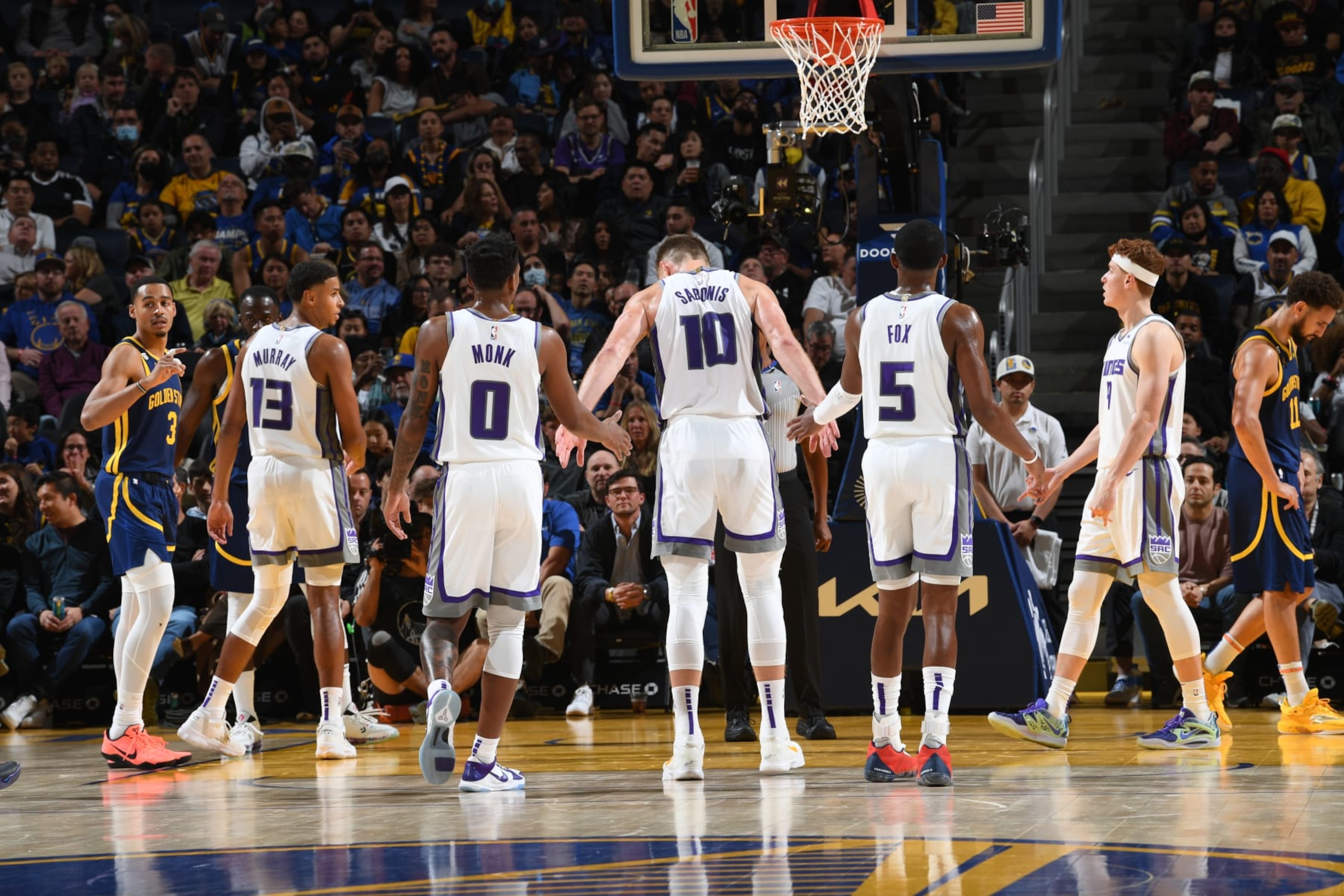 SAN FRANCISCO, CA - OCTOBER 23: Domantas Sabonis #10 of the Sacramento Kings prepares to shoot a free throw and high-fives his teammates during the game against the Golden State Warriors on October 23, 2022 at Chase Center in San Francisco, California. NOTE TO USER: User expressly acknowledges and agrees that, by downloading and or using this photograph, user is consenting to the terms and conditions of Getty Images License Agreement. Mandatory Copyright Notice: Copyright 2022 NBAE (Photo by Noah Graham/NBAE via Getty Images)