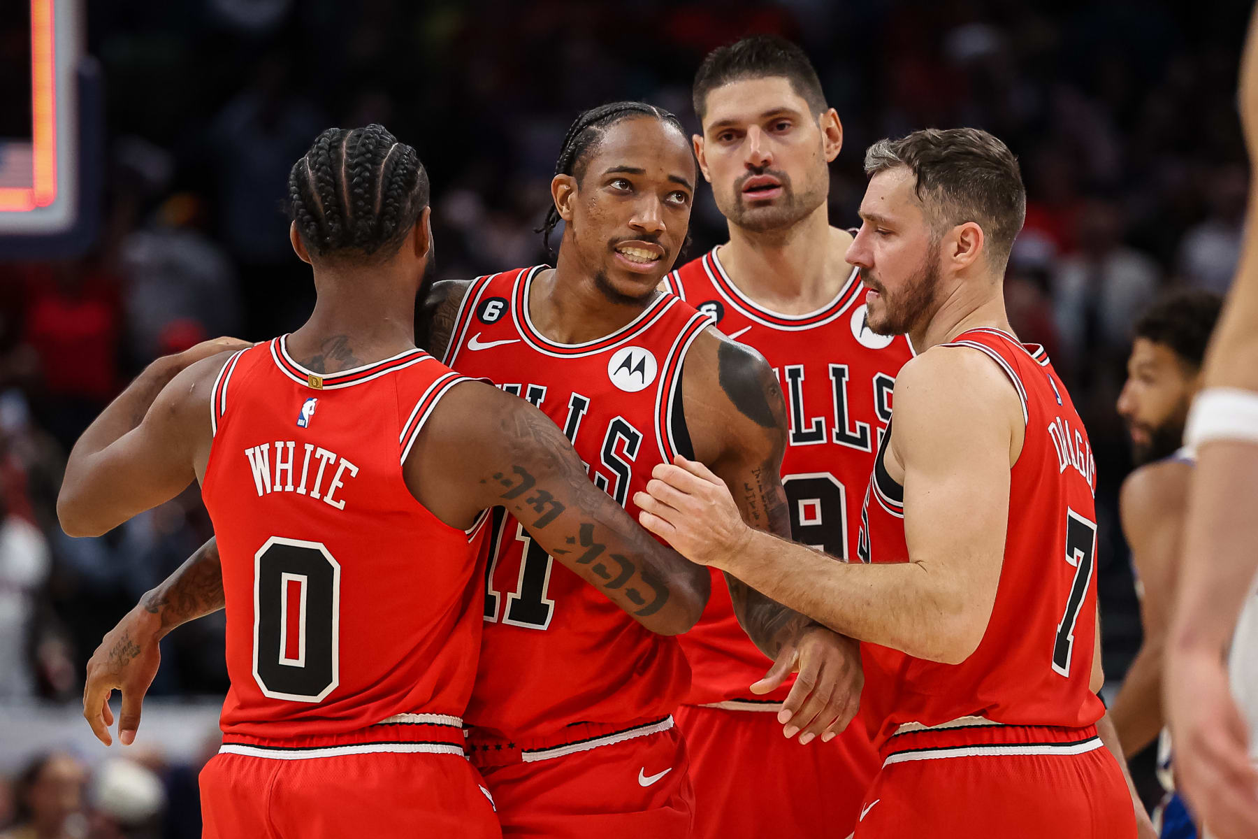 WASHINGTON, DC - OCTOBER 21: DeMar DeRozan #11 of the Chicago Bulls is consoled by teammates after missing the potential game winning three point basket with two seconds left in the game against the Washington Wizards at Capital One Arena on October 21, 2022 in Washington, DC. NOTE TO USER: User expressly acknowledges and agrees that, by downloading and or using this photograph, User is consenting to the terms and conditions of the Getty Images License Agreement. (Photo by Scott Taetsch/Getty Images)