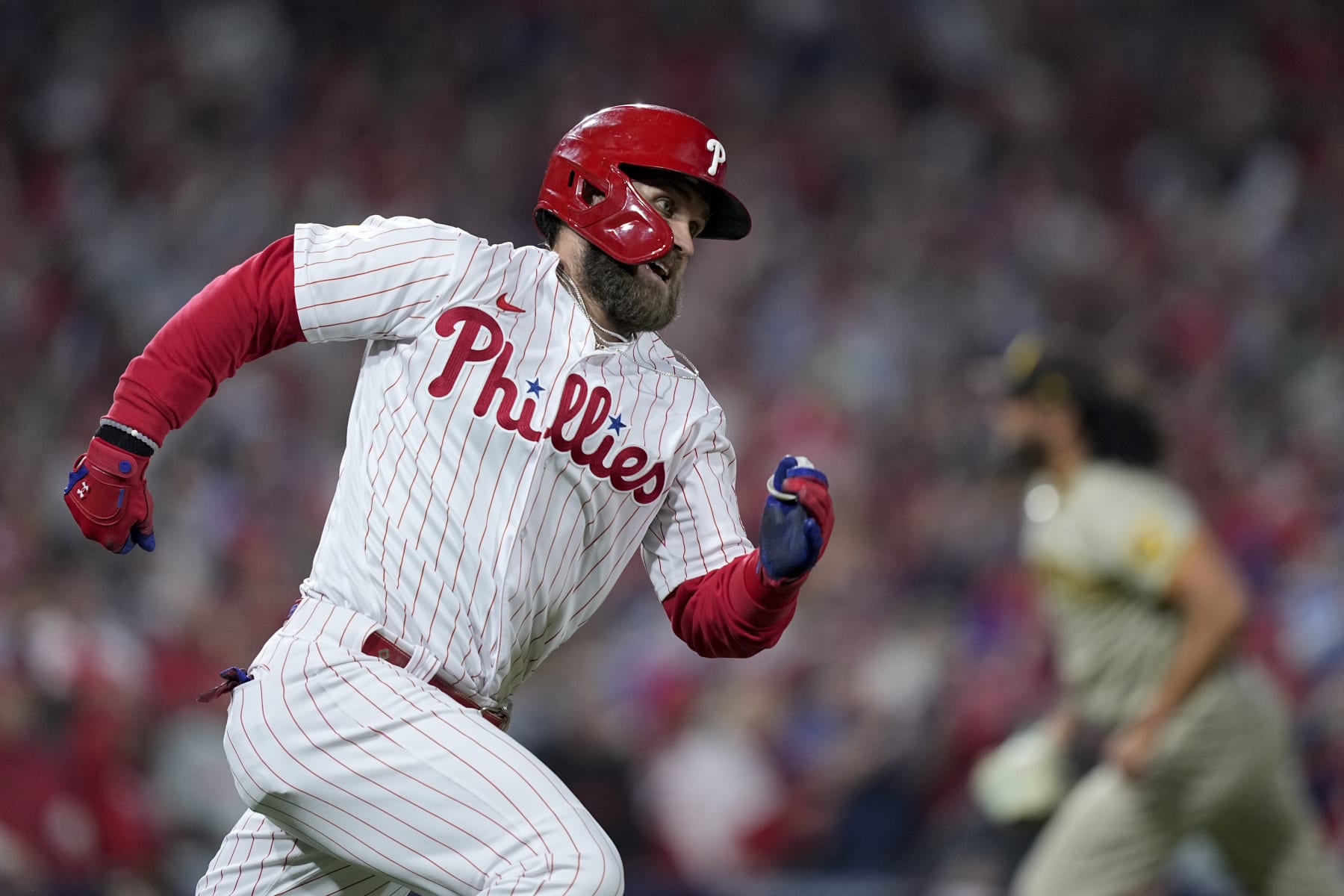Philadelphia Phillies' Bryce Harper celebrates after his RBI double during the fifth inning in Game 4 of the baseball NL Championship Series between the San Diego Padres and the Phillies on Saturday, Oct. 22, 2022, in Philadelphia. (AP Photo/Matt Rourke)