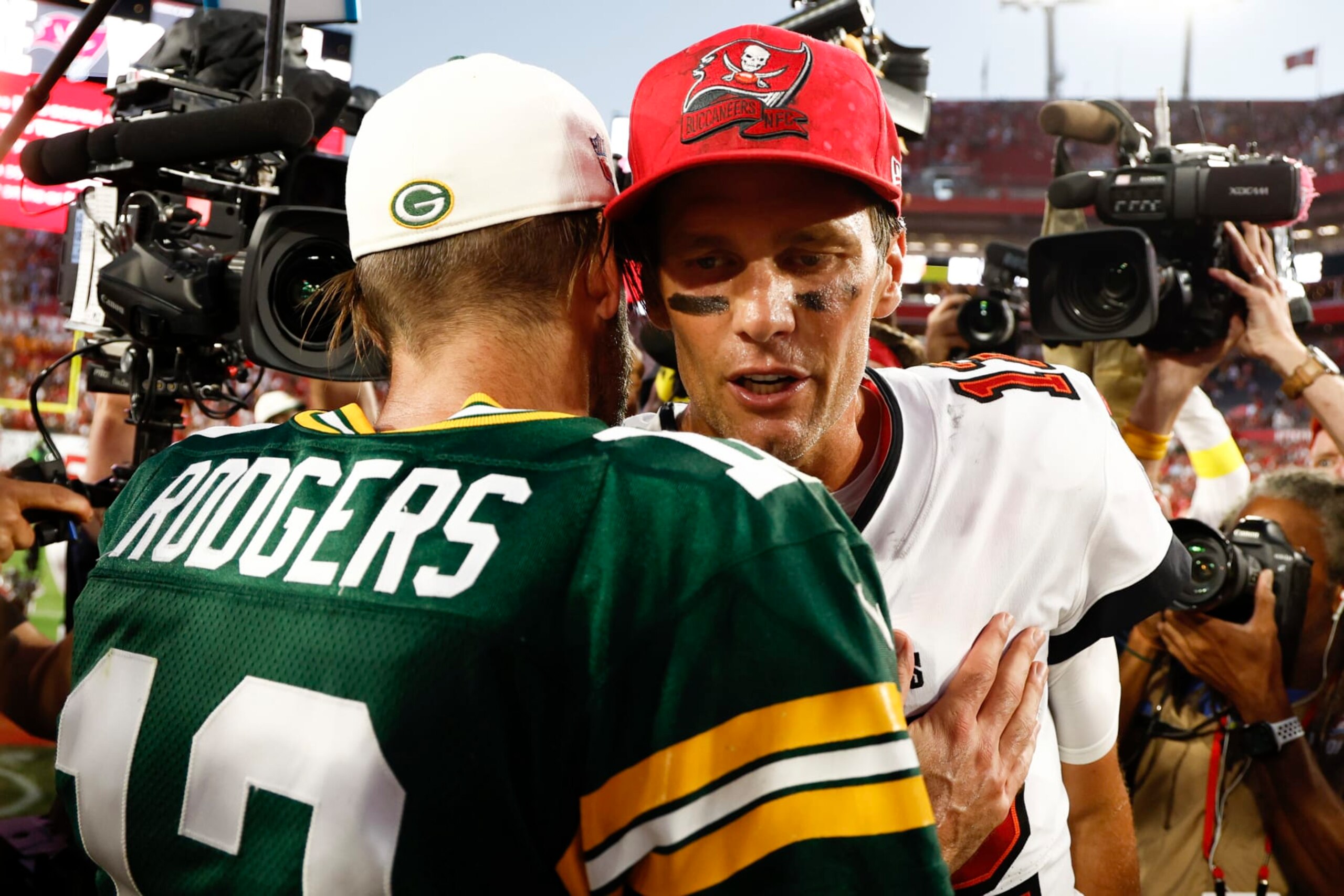 TAMPA, FLORIDA - SEPTEMBER 25: Aaron Rodgers #12 of the Green Bay Packers talks with Tom Brady #12 of the Tampa Bay Buccaneers after the game at Raymond James Stadium on September 25, 2022 in Tampa, Florida. (Photo by Douglas P. DeFelice/Getty Images)
