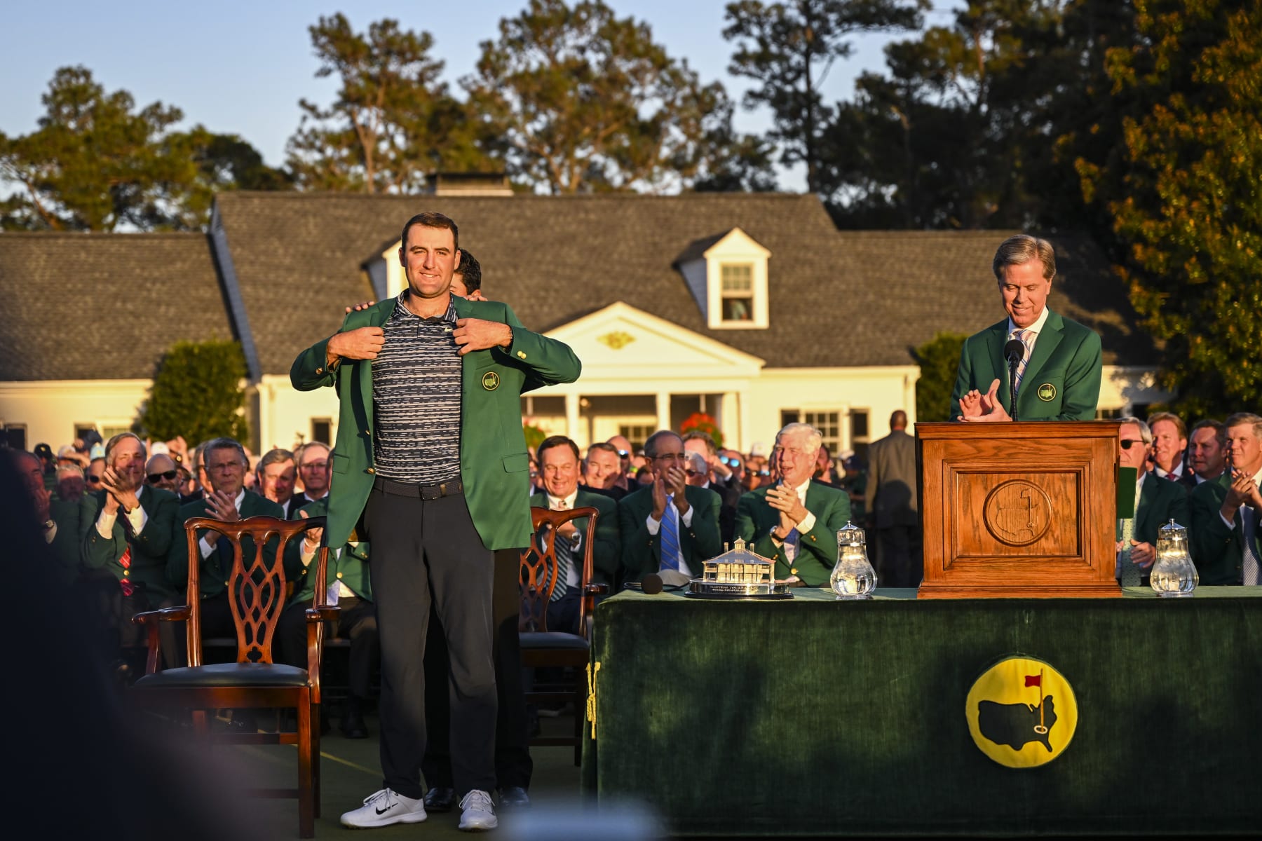 AUGUSTA, GA - APRIL 10:  Scottie Scheffler receives the Green Jacket from Hideki Matsuyama of Japan after his three stroke victory following the final round of the Masters at Augusta National Golf Club on April 10, 2022, in Augusta, Georgia. (Photo by Keyur Khamar/PGA TOUR via Getty Images)