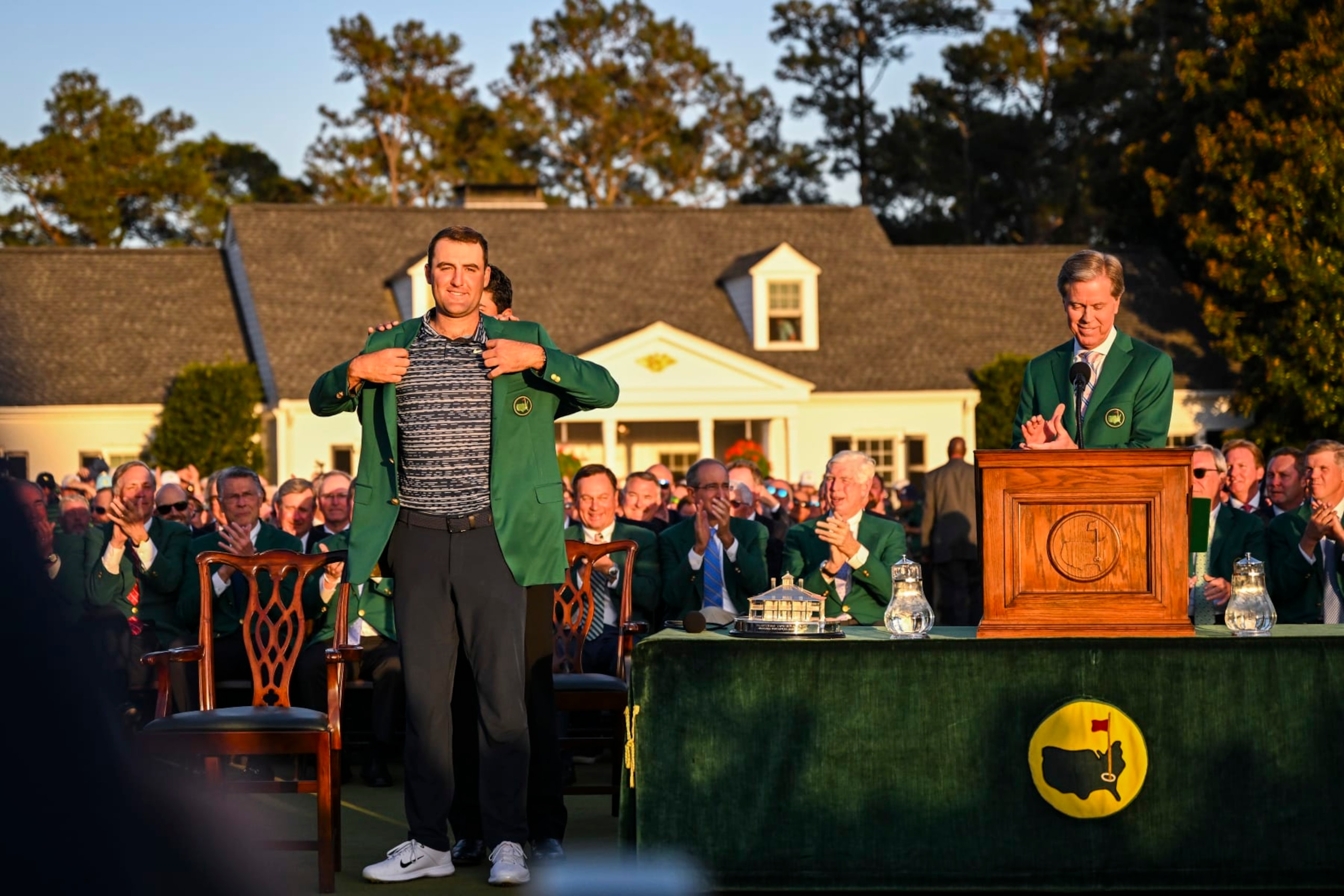 AUGUSTA, GA - APRIL 10: Scottie Scheffler receives the Green Jacket from Hideki Matsuyama of Japan after his three stroke victory following the final round of the Masters at Augusta National Golf Club on April 10, 2022, in Augusta, Georgia. (Photo by Keyur Khamar/PGA TOUR via Getty Images) AUGUSTA, GA - APRIL 10: Scottie Scheffler receives the Green Jacket from Hideki Matsuyama of Japan after his three stroke victory following the final round of the Masters at Augusta National Golf Club on April 10, 2022, in Augusta, Georgia. (Photo by Keyur Khamar/PGA TOUR via Getty Images)