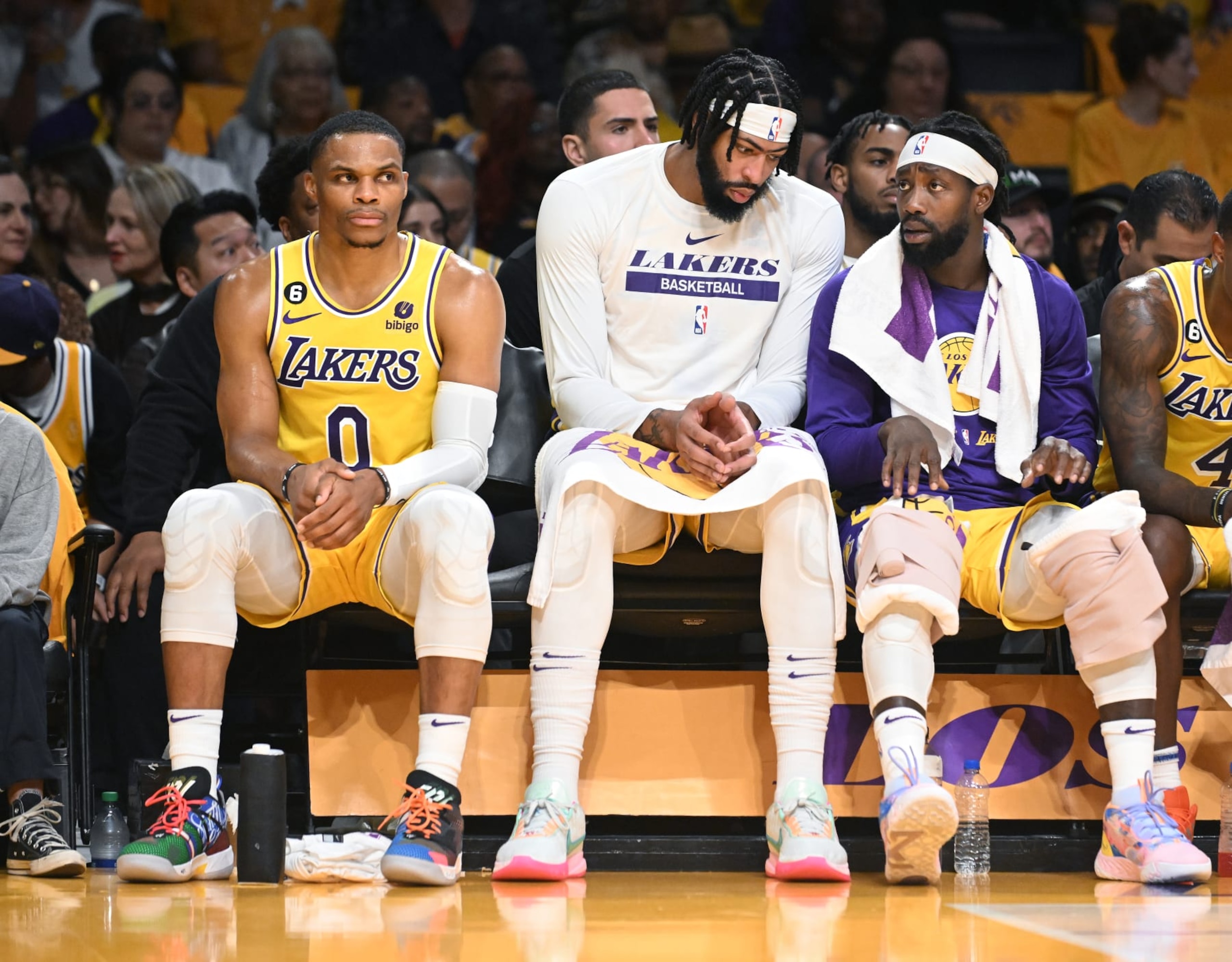 Los Angeles, California October 20, 2022-Lakers from left Russell Westbrook, Anthony Davis and Patrick Beverly sit on the bench during a game against the Clippers at Crypto Arena in Los Angeles Thursday. (Wally Skalij/Los Angeles Times via Getty Images)