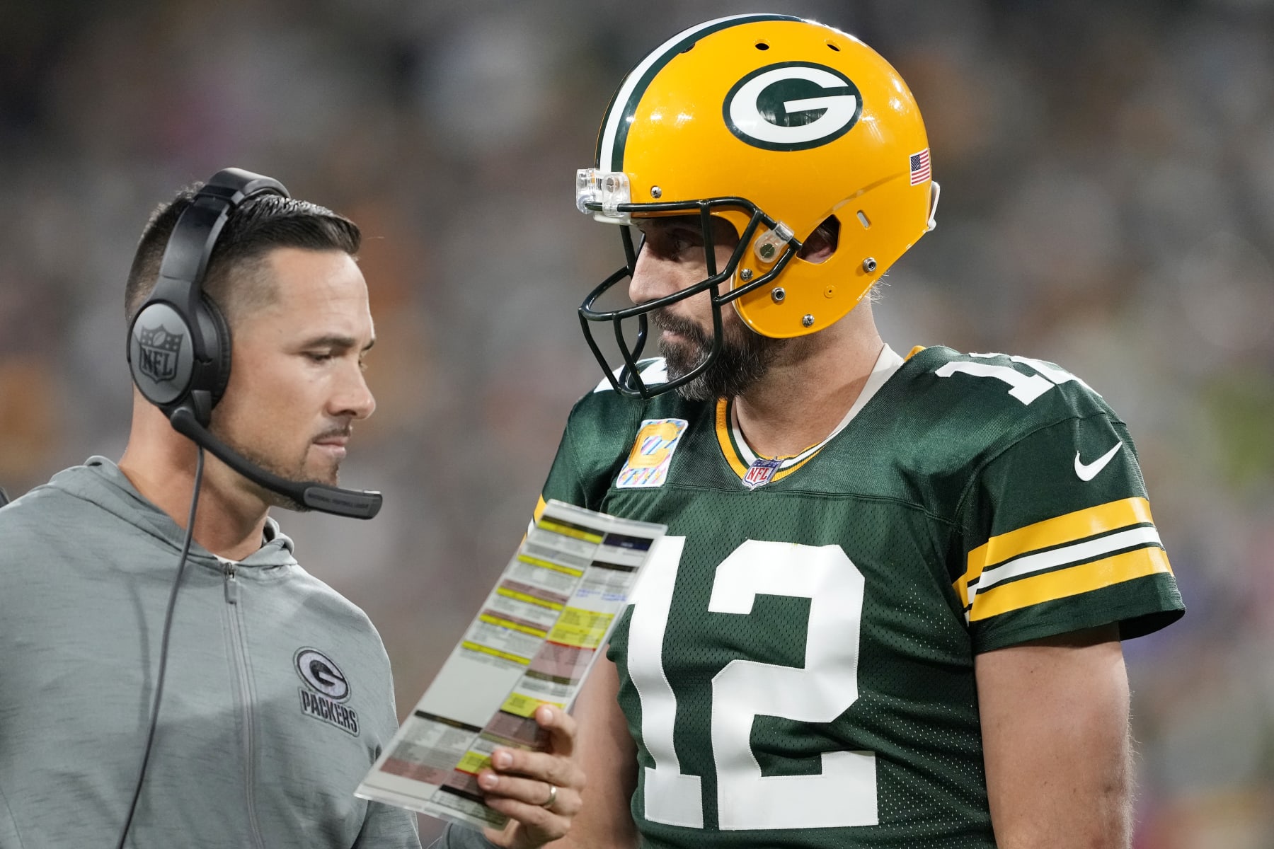 GREEN BAY, WISCONSIN - OCTOBER 02: Head coach Matt LaFleur of the Green Bay Packers talks to Aaron Rodgers #12 of the Green Bay Packers during overtime against the New England Patriots at Lambeau Field on October 02, 2022 in Green Bay, Wisconsin. (Photo by Patrick McDermott/Getty Images)