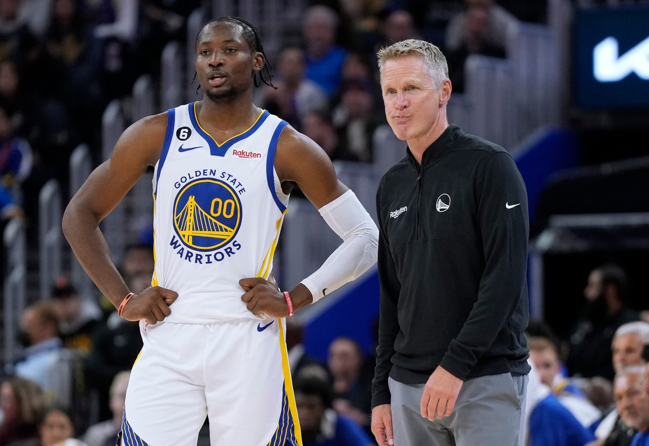 SAN FRANCISCO, CALIFORNIA - OCTOBER 14: Head coach Steve Kerr and Jonathan Kuminga #00 of the Golden State Warriors talk with each other during a break in the action against the Denver Nuggets in the second half of an NBA basketball game at Chase Center on October 14, 2022 in San Francisco, California. NOTE TO USER: User expressly acknowledges and agrees that, by downloading and or using this photograph, User is consenting to the terms and conditions of the Getty Images License Agreement. (Photo by Thearon W. Henderson/Getty Images)