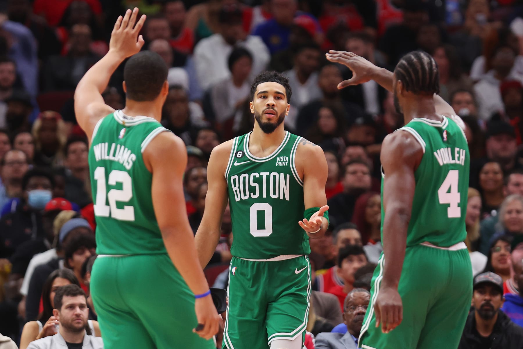 CHICAGO, ILLINOIS - OCTOBER 24: Jayson Tatum #0 of the Boston Celtics celebrates with Grant Williams #12 and Noah Vonleh #4 against the Chicago Bulls during the second half at United Center on October 24, 2022 in Chicago, Illinois. NOTE TO USER: User expressly acknowledges and agrees that, by downloading and or using this photograph, User is consenting to the terms and conditions of the Getty Images License Agreement. (Photo by Michael Reaves/Getty Images)