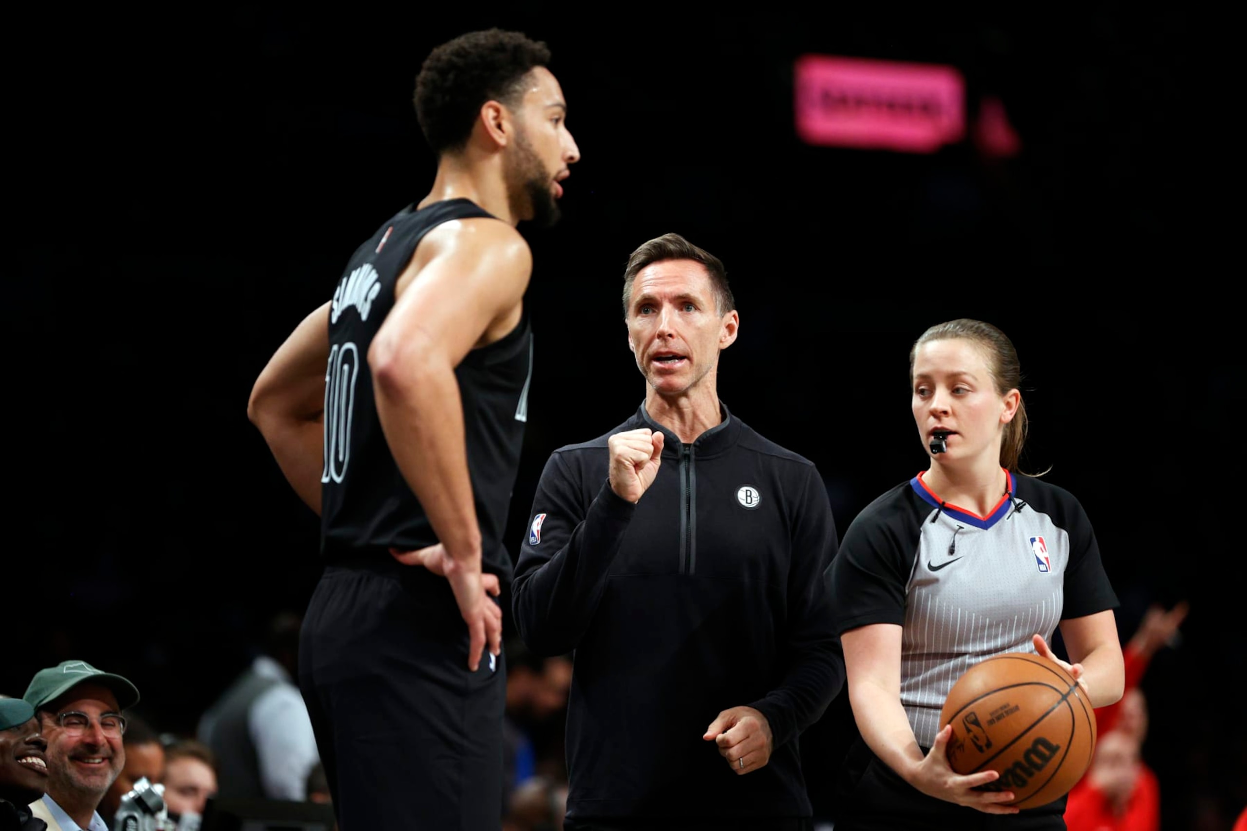 NEW YORK, NEW YORK - OCTOBER 21: Head coach Steve Nash talks with Ben Simmons #10 of the Brooklyn Nets as referee Dannica Mosher #89 looks on during the first half against the Toronto Raptors at Barclays Center on October 21, 2022 in the Brooklyn borough of New York City. NOTE TO USER: User expressly acknowledges and agrees that, by downloading and or using this photograph, User is consenting to the terms and conditions of the Getty Images License Agreement. (Photo by Sarah Stier/Getty Images)