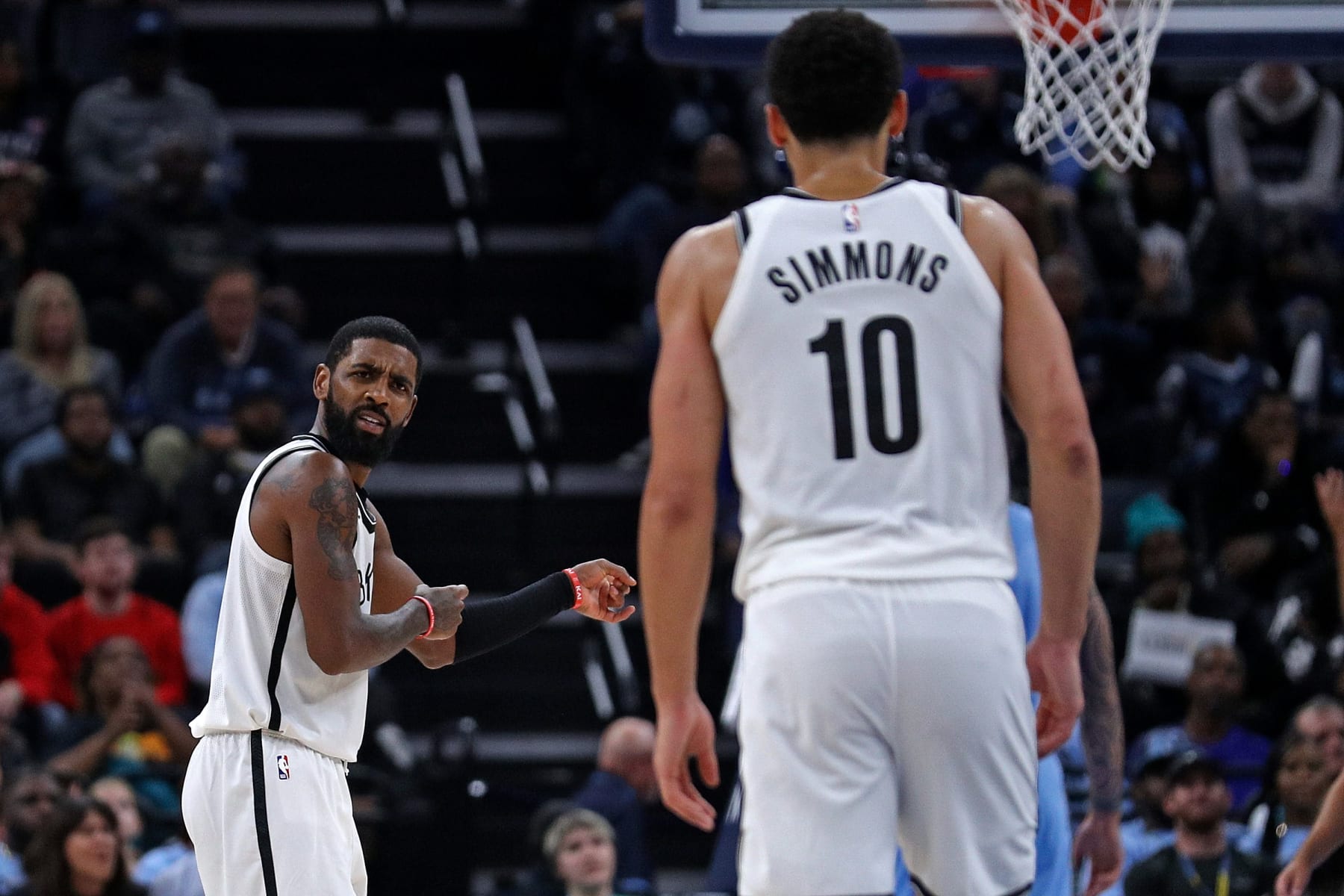MEMPHIS, TENNESSEE - OCTOBER 24: Kyrie Irving #11 of the Brooklyn Nets gestures twoards Ben Simmons #10 during the game against the Memphis Grizzlies at FedExForum on October 24, 2022 in Memphis, Tennessee. NOTE TO USER: User expressly acknowledges and agrees that, by downloading and or using this photograph, User is consenting to the terms and conditions of the Getty Images License Agreement. (Photo by Justin Ford/Getty Images)