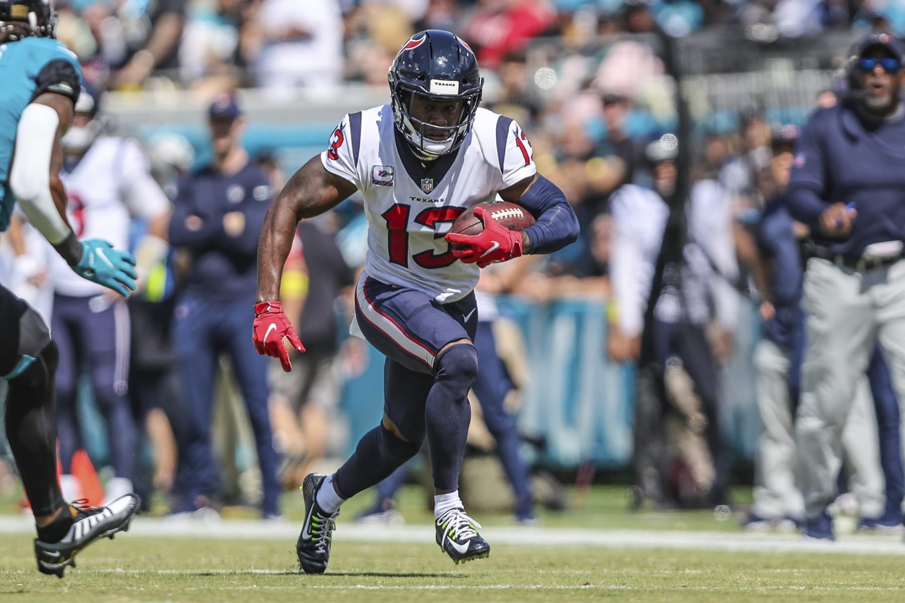 Houston Texans wide receiver Brandin Cooks (13) runs the ball after a catch during an NFL football game against the Jacksonville Jaguars on Sunday, Oct. 9, 2022, in Jacksonville, Fla. (AP Photo/Gary McCullough)