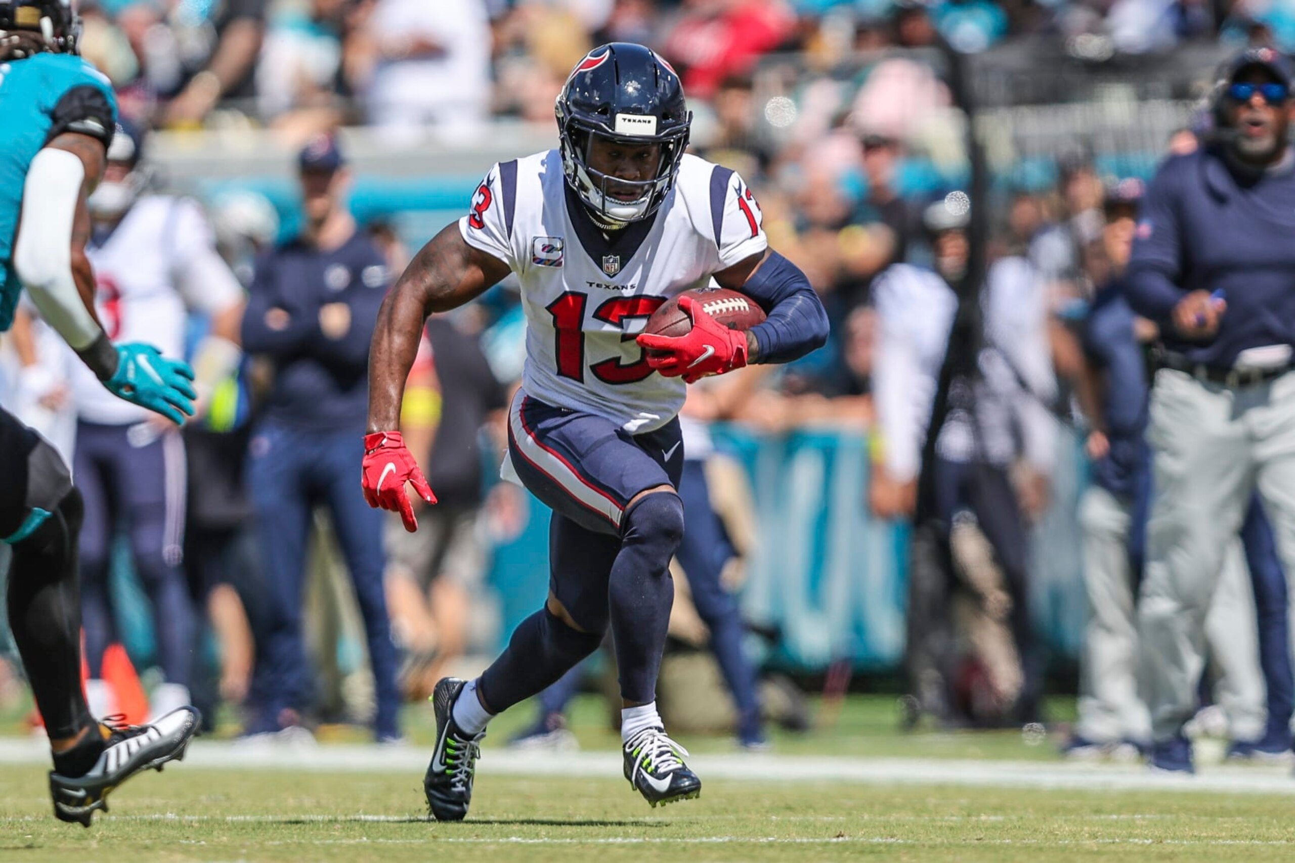 Houston Texans wide receiver Brandin Cooks (13) runs the ball after a catch during an NFL football game against the Jacksonville Jaguars on Sunday, Oct. 9, 2022, in Jacksonville, Fla. (AP Photo/Gary McCullough)