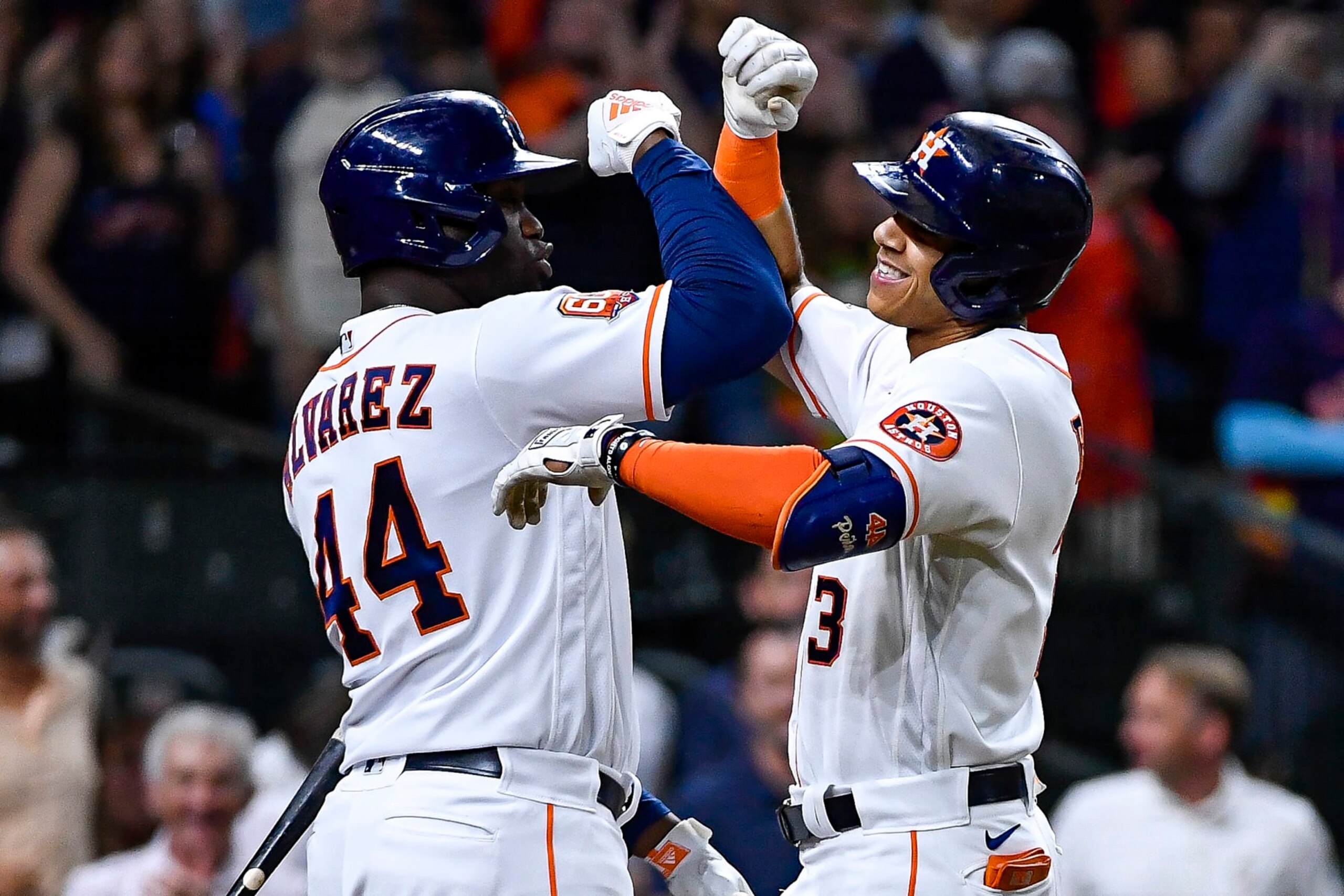 HOUSTON, TEXAS - OCTOBER 04: Jeremy Pena #3 celebrates with Yordan Alvarez #44 of the Houston Astros after hitting a home run against the Philadelphia Phillies at Minute Maid Park on October 04, 2022 in Houston, Texas. (Photo by Logan Riely/Getty Images)