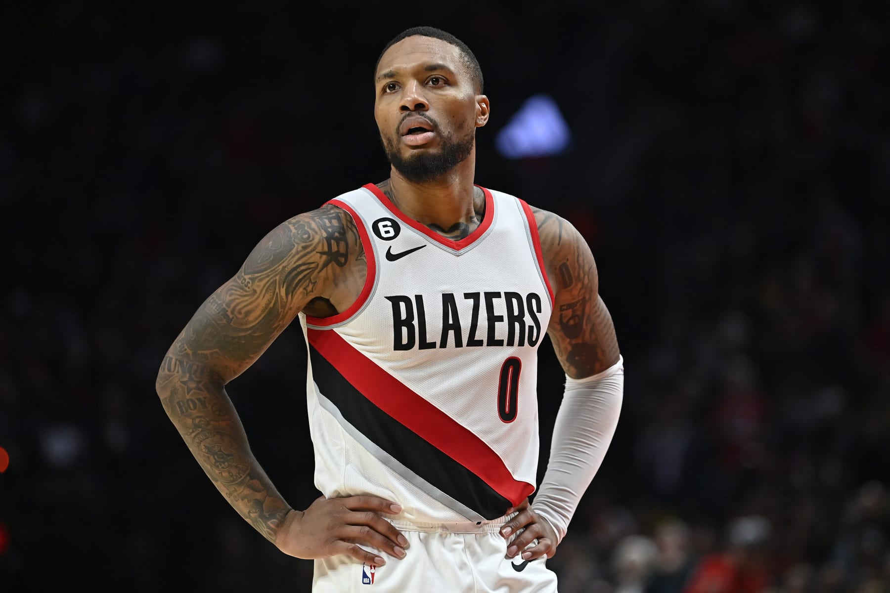 PORTLAND, OREGON - OCTOBER 24: Damian Lillard #0 of the Portland Trail Blazers looks on during the third quarter against the Denver Nuggets at Moda Center on October 24, 2022 in Portland, Oregon. The Portland Trail Blazers won 135-110. NOTE TO USER: User expressly acknowledges and agrees that, by downloading and or using this photograph, User is consenting to the terms and conditions of the Getty Images License Agreement. (Photo by Alika Jenner/Getty Images)
