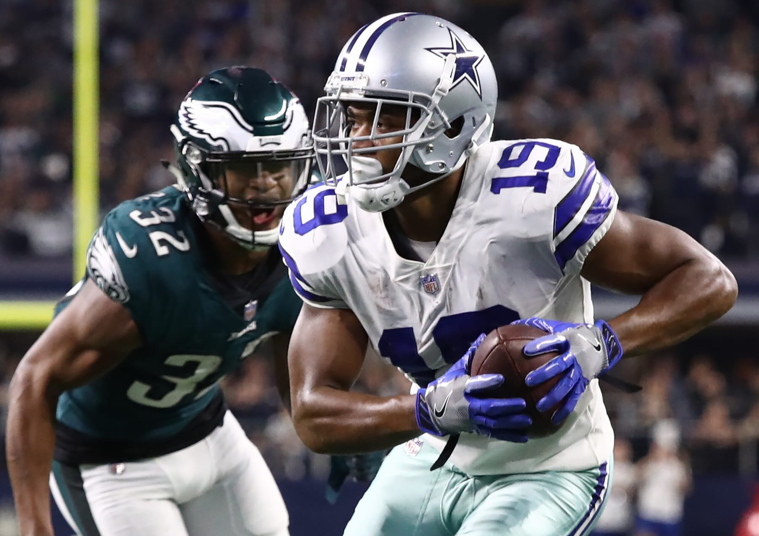 ARLINGTON, TEXAS - DECEMBER 09:  Amari Cooper #19 of the Dallas Cowboys runs for a touchdown past Rasul Douglas #32 of the Philadelphia Eagles in overtime for a 29-23 win at AT&T Stadium on December 09, 2018 in Arlington, Texas. (Photo by Ronald Martinez/Getty Images)