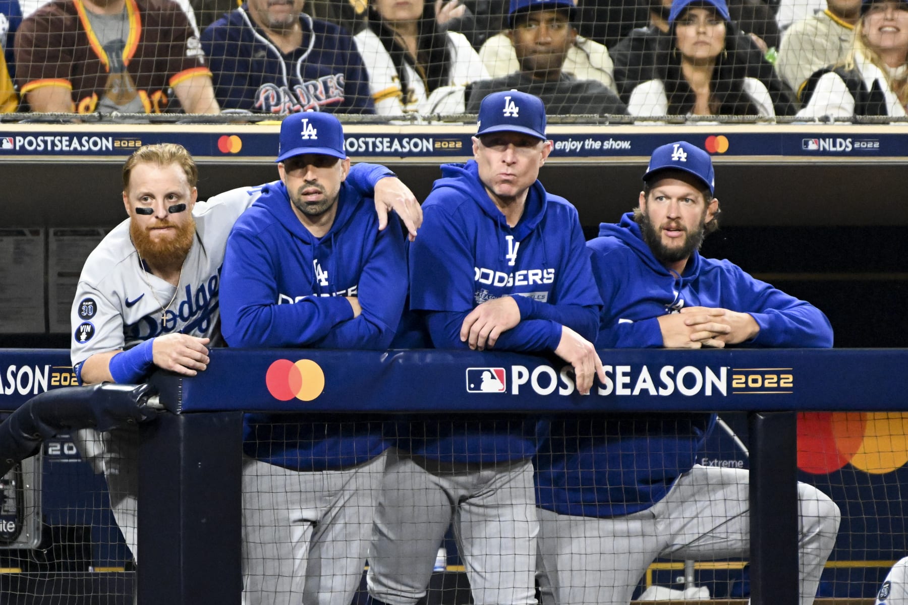 San Diego, CA - October 14: Los Angeles Dodgers Justin Turner, left, and Clayton Kershaw, right, watch the game from the dugout during the second inning in game 3 of the NLDS against the San Diego Padres at Petco Park on Friday, Oct. 14, 2022 in San Diego, CA. (Wally Skalij / Los Angeles Times via Getty Images)