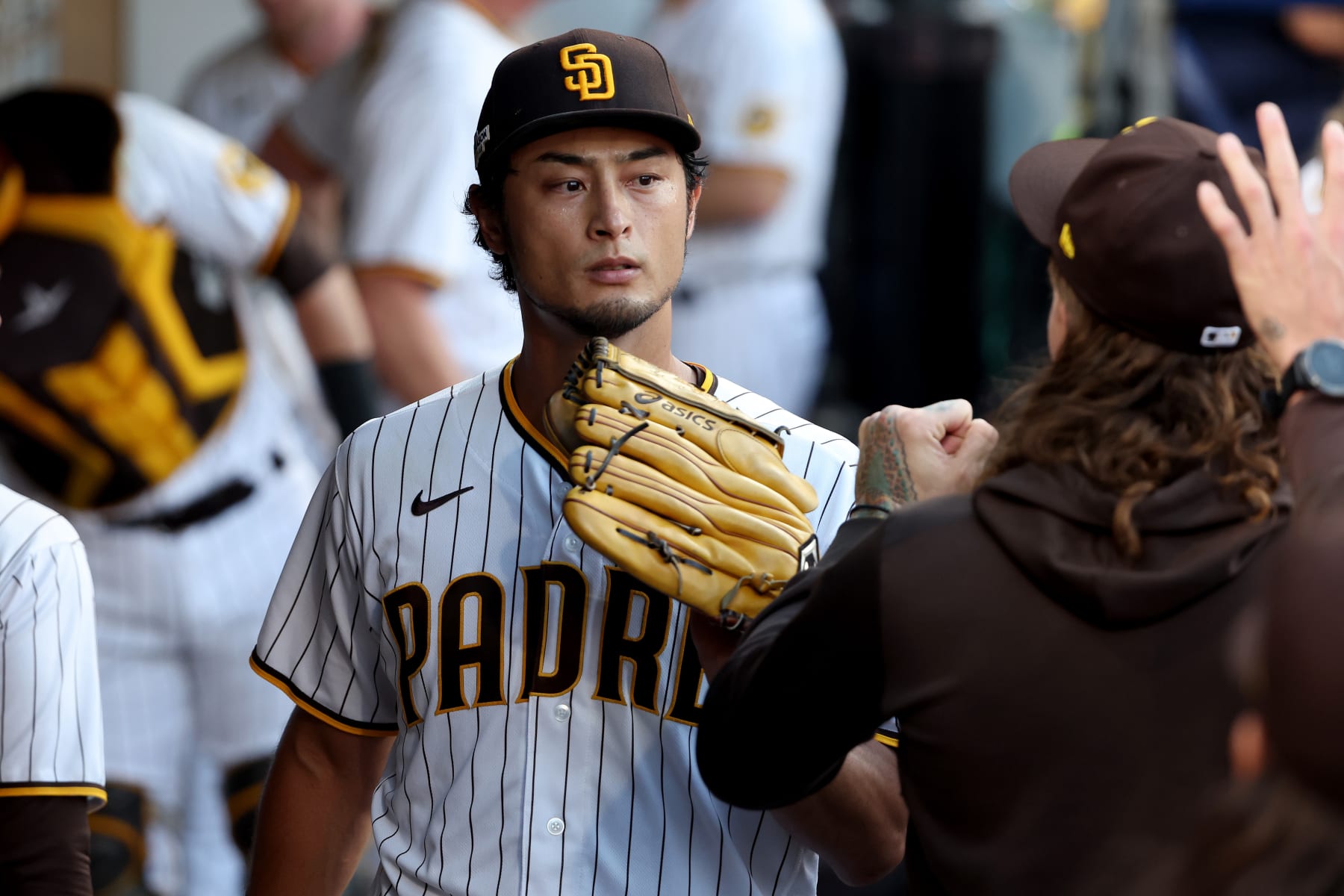 SAN DIEGO, CALIFORNIA - OCTOBER 18: Yu Darvish #11 of the San Diego Padres in the dugout after the third out is made during the second inning against the Philadelphia Phillies in game one of the National League Championship Series at PETCO Park on October 18, 2022 in San Diego, California. (Photo by Sean M. Haffey/Getty Images)