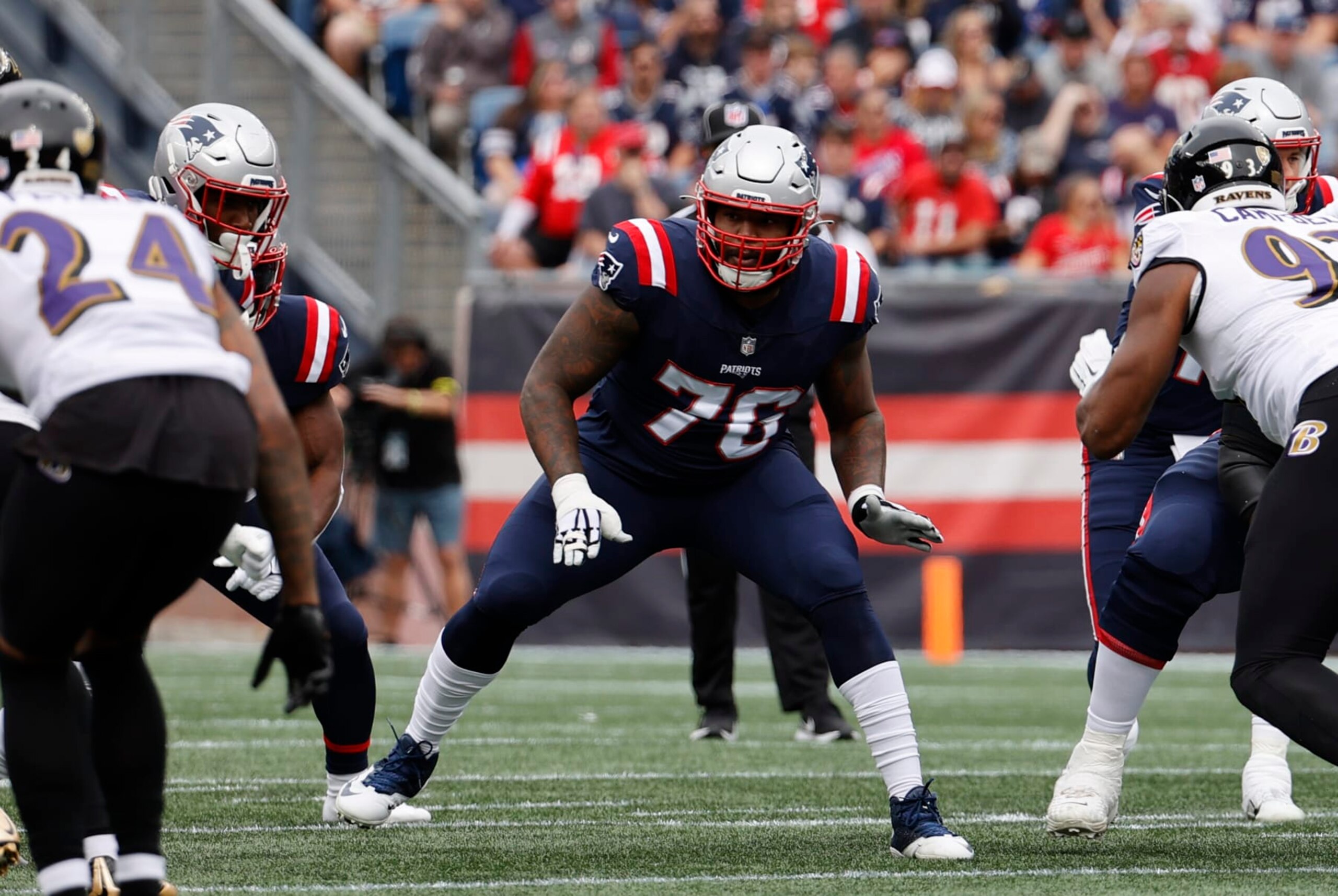 FOXBOROUGH, MA - SEPTEMBER 25: New England Patriots offensive tackle Isaiah Wynn (76) blocks during a game between the New England Patriots and the Baltimore Ravens on September 25, 2022, at Gillette Stadium in Foxborough, Massachusetts. (Photo by Fred Kfoury III/Icon Sportswire via Getty Images)