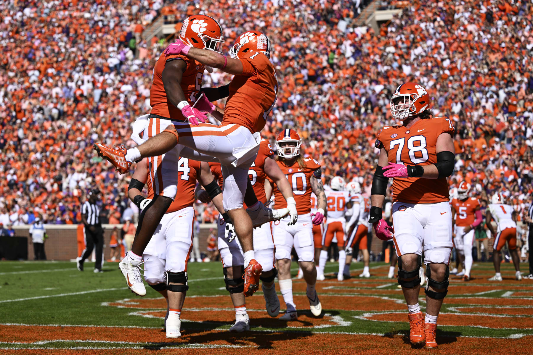 DJ Uiagalelei (left) and Will Shipley (center) celebrate a touchdown. (Photo by Eakin Howard/Getty Images)