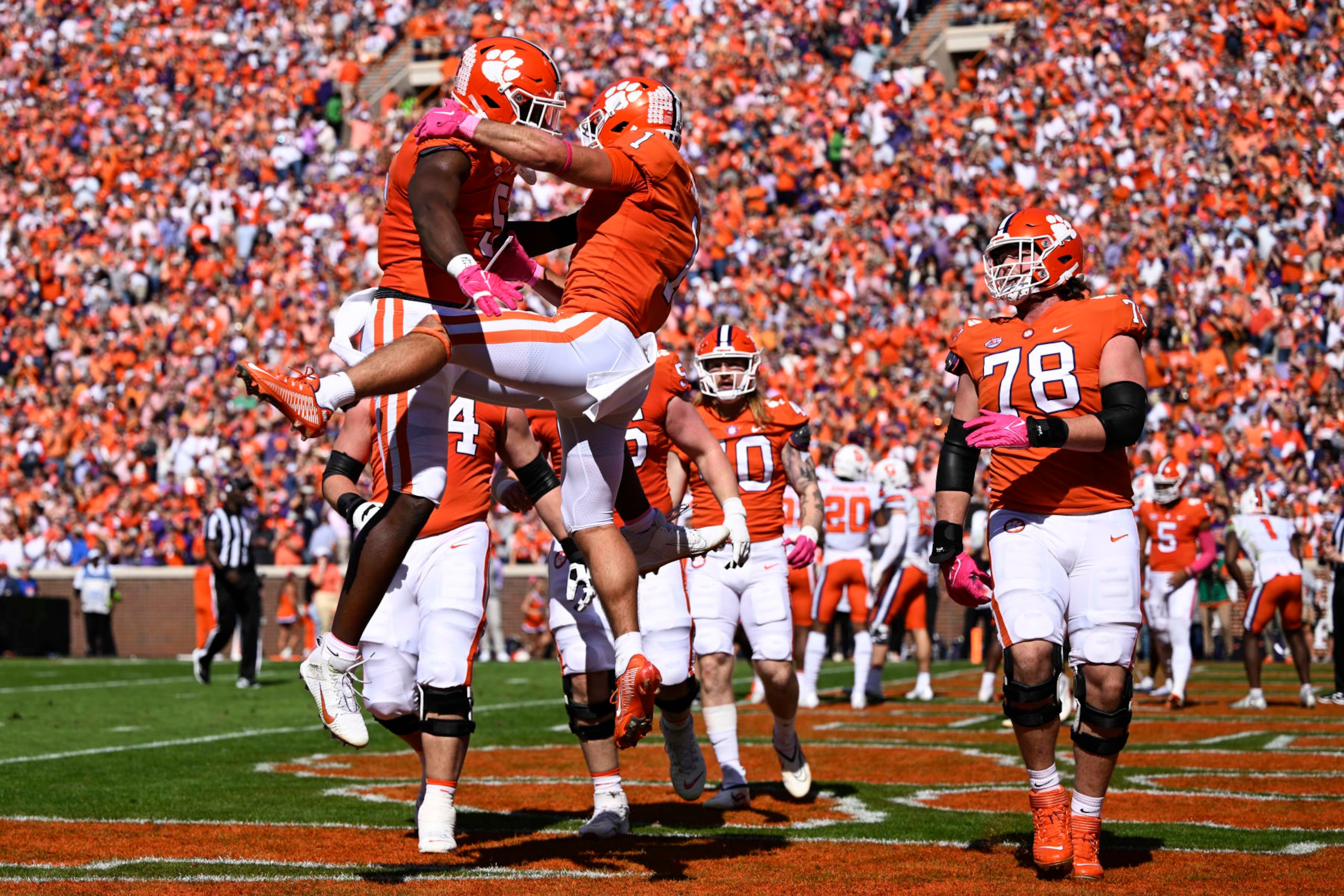 DJ Uiagalelei (left) and Will Shipley (center) celebrate a touchdown. (Photo by Eakin Howard/Getty Images)