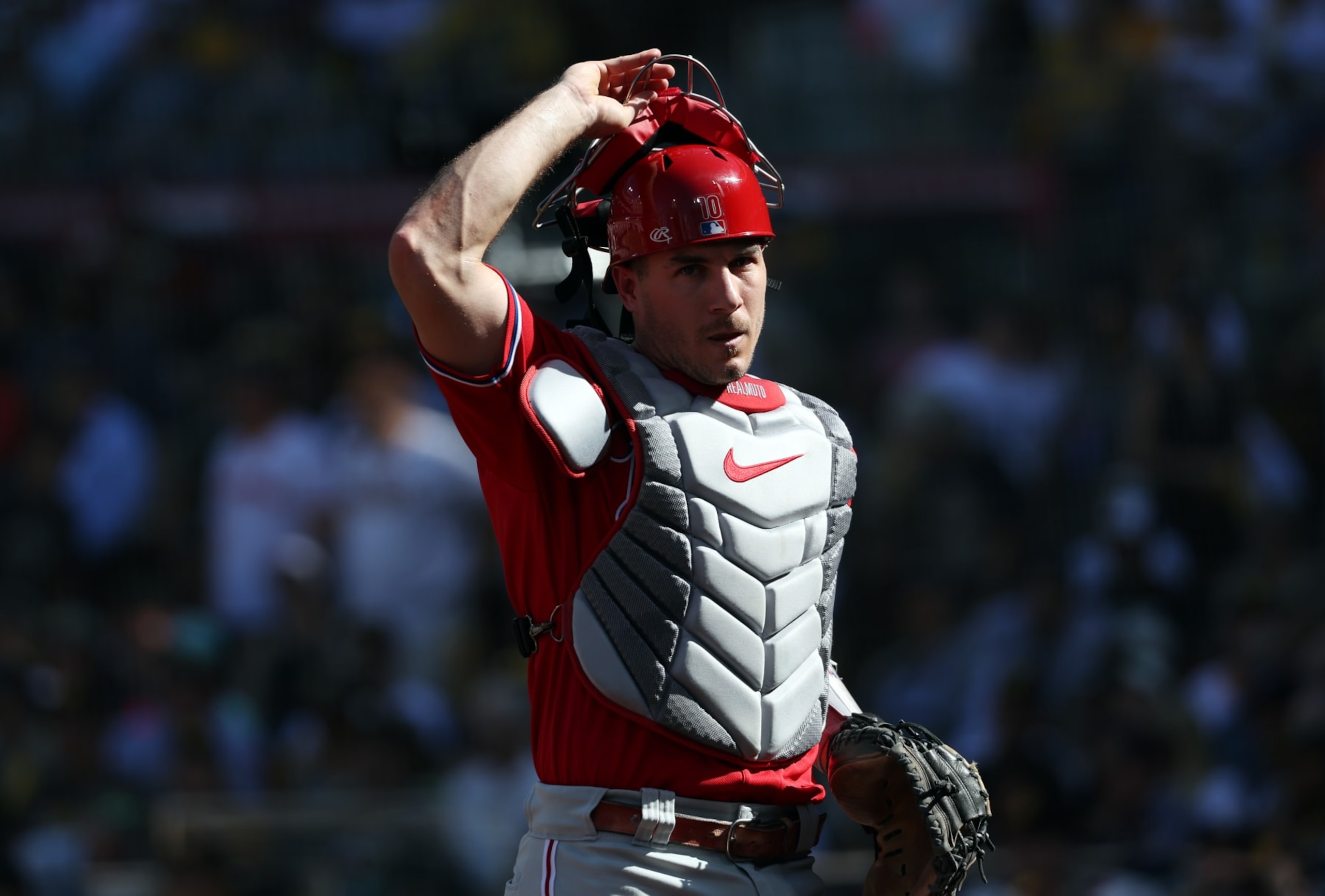 SAN DIEGO, CALIFORNIA - OCTOBER 19: J.T. Realmuto #10 of the Philadelphia Phillies reacts during the first inning against the San Diego Padres in game two of the National League Championship Series at PETCO Park on October 19, 2022 in San Diego, California. (Photo by Harry How/Getty Images)