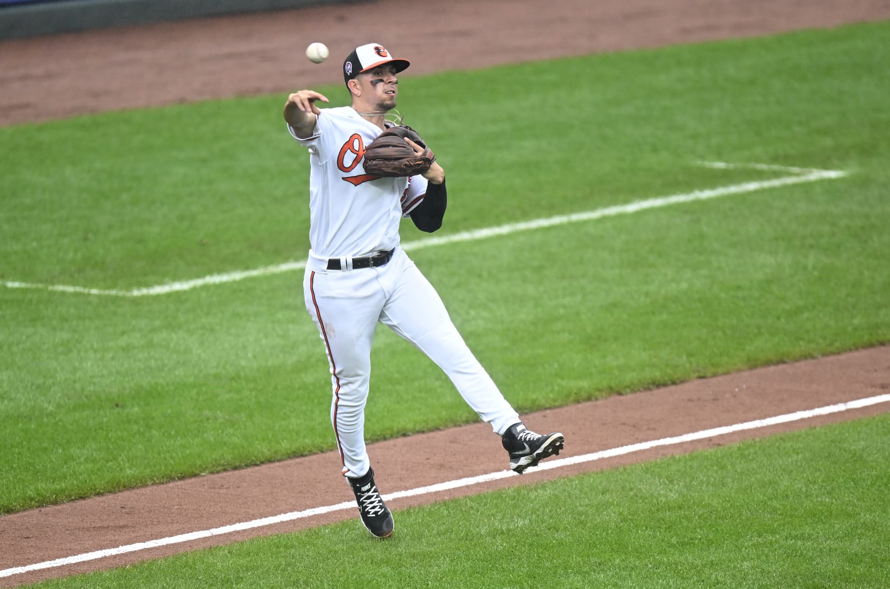 BALTIMORE, MARYLAND - SEPTEMBER 11: Ramon Urias #29 of the Baltimore Orioles throws the ball to first base against the Boston Red Sox at Oriole Park at Camden Yards on September 11, 2022 in Baltimore, Maryland. (Photo by G Fiume/Getty Images)