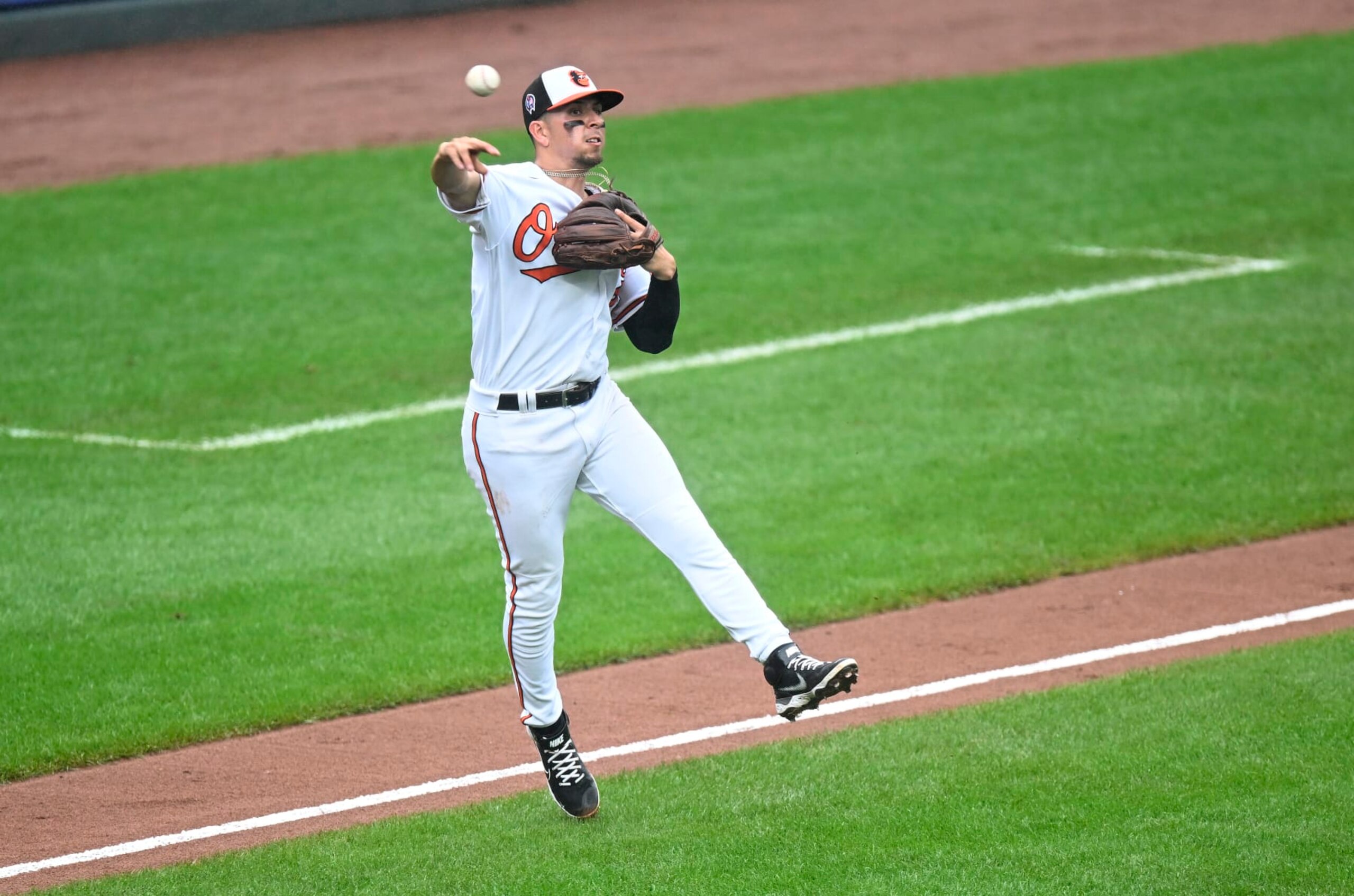 BALTIMORE, MARYLAND - SEPTEMBER 11: Ramon Urias #29 of the Baltimore Orioles throws the ball to first base against the Boston Red Sox at Oriole Park at Camden Yards on September 11, 2022 in Baltimore, Maryland. (Photo by G Fiume/Getty Images)