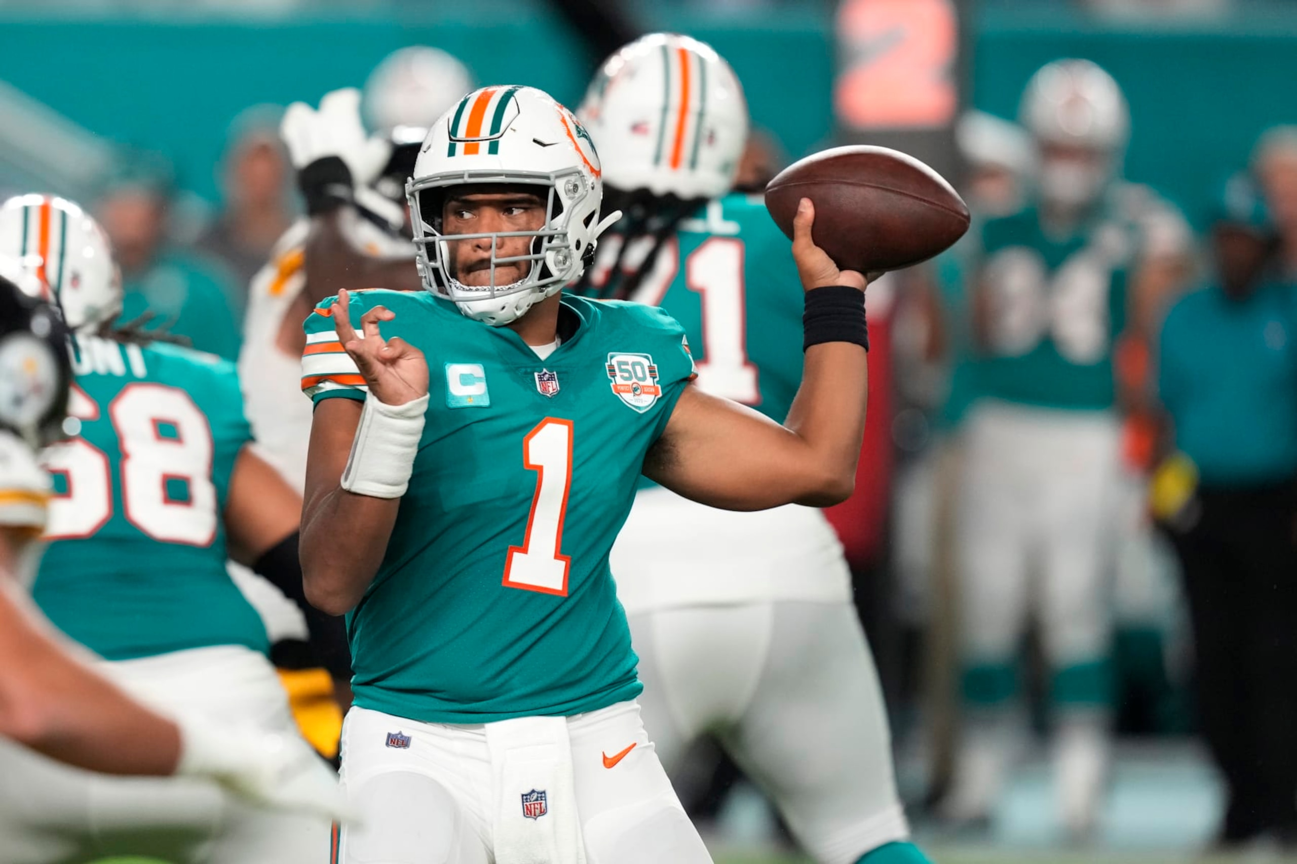 Miami Dolphins quarterback Tua Tagovailoa (1) aims a pass during the second half of an NFL football game against the Pittsburgh Steelers, Sunday, Oct. 23, 2022, in Miami Gardens, Fla. (AP Photo/Rebecca Blackwell)