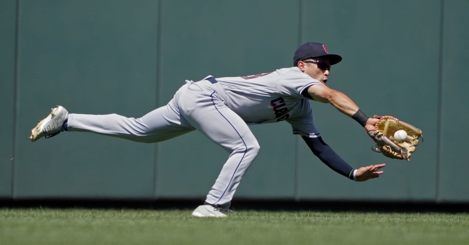 KANSAS CITY, MISSOURI - JULY 09: Steven Kwan #38 of the Cleveland Guardians catches a ball hit by Whit Merrifield of the Kansas City Royals in the first inning at Kauffman Stadium on July 09, 2022 in Kansas City, Missouri. (Photo by Ed Zurga/Getty Images)