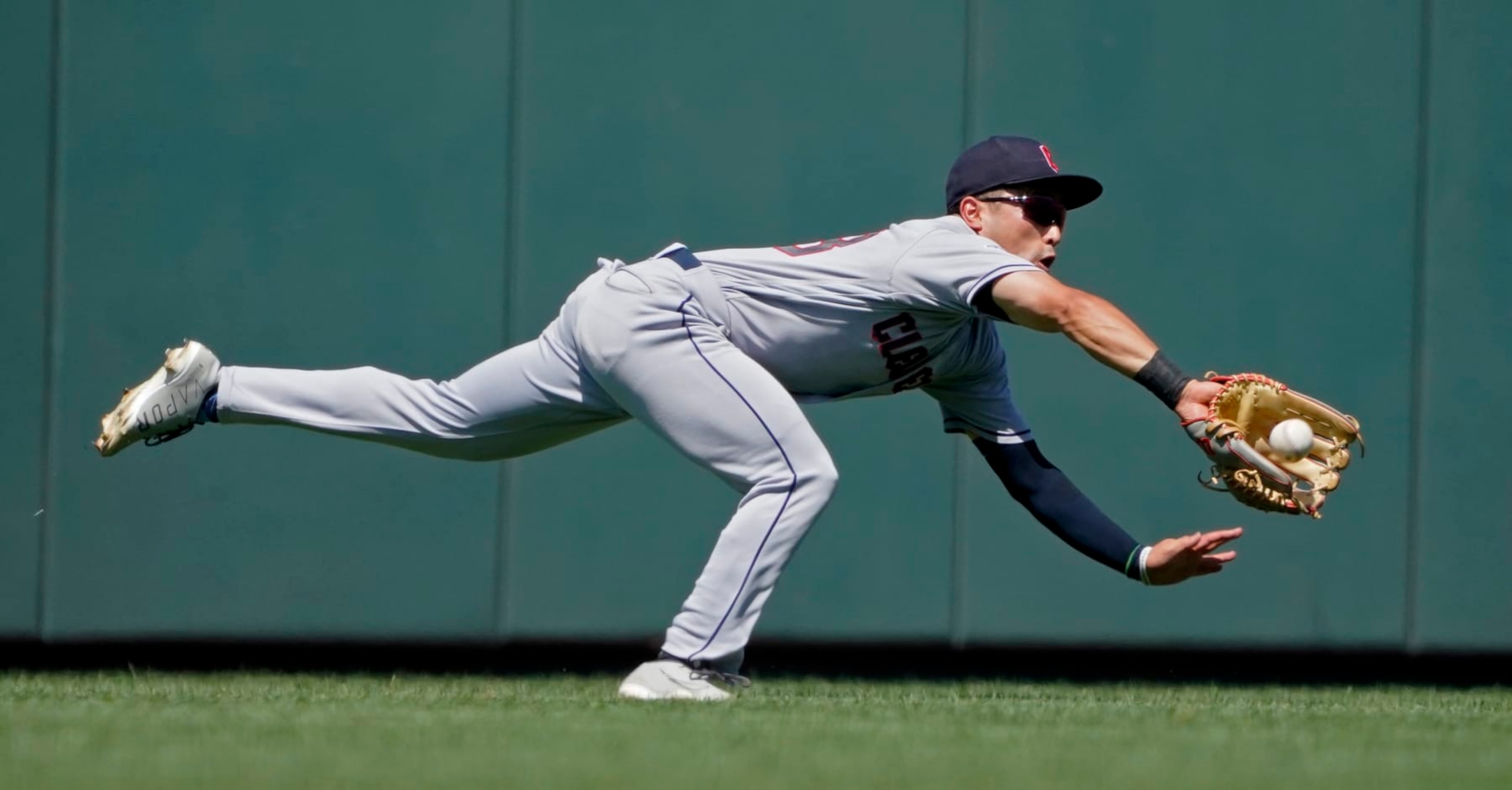 KANSAS CITY, MISSOURI - JULY 09: Steven Kwan #38 of the Cleveland Guardians catches a ball hit by Whit Merrifield of the Kansas City Royals in the first inning at Kauffman Stadium on July 09, 2022 in Kansas City, Missouri. (Photo by Ed Zurga/Getty Images)