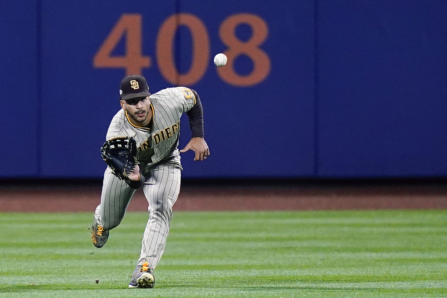 San Diego Padres center fielder Trent Grisham makes the catch on a line drive by New York Mets' Jeff McNeil during the fifth inning of Game 2 of an NL wild-card baseball playoff series Saturday, Oct. 8, 2022, in New York. (AP Photo/Frank Franklin II)