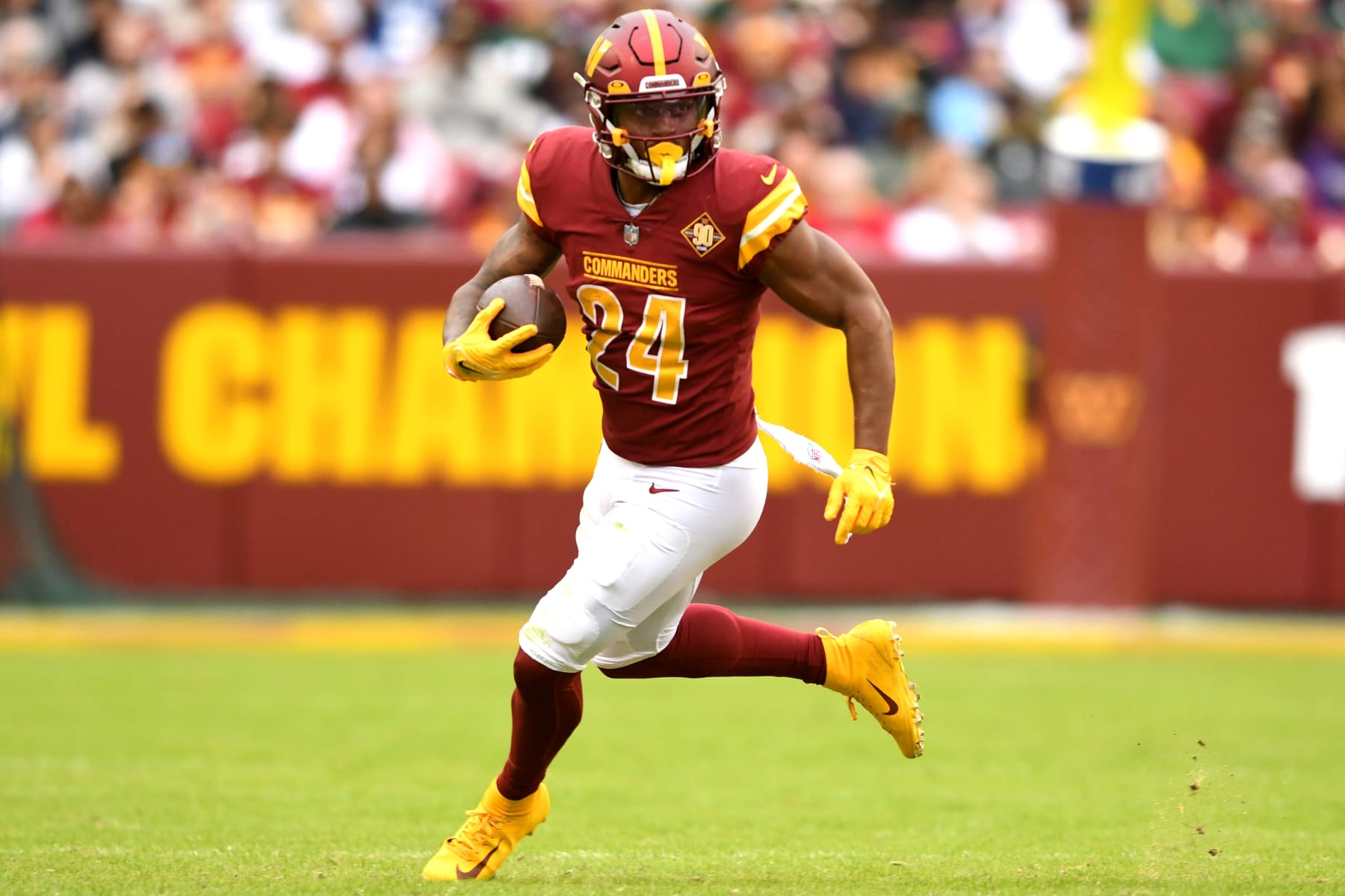 LANDOVER, MARYLAND - OCTOBER 23: Antonio Gibson #24 of the Washington Commanders runs the ball during the second half of the game against the Green Bay Packers at FedExField on October 23, 2022 in Landover, Maryland. (Photo by Mitchell Layton/Getty Images)