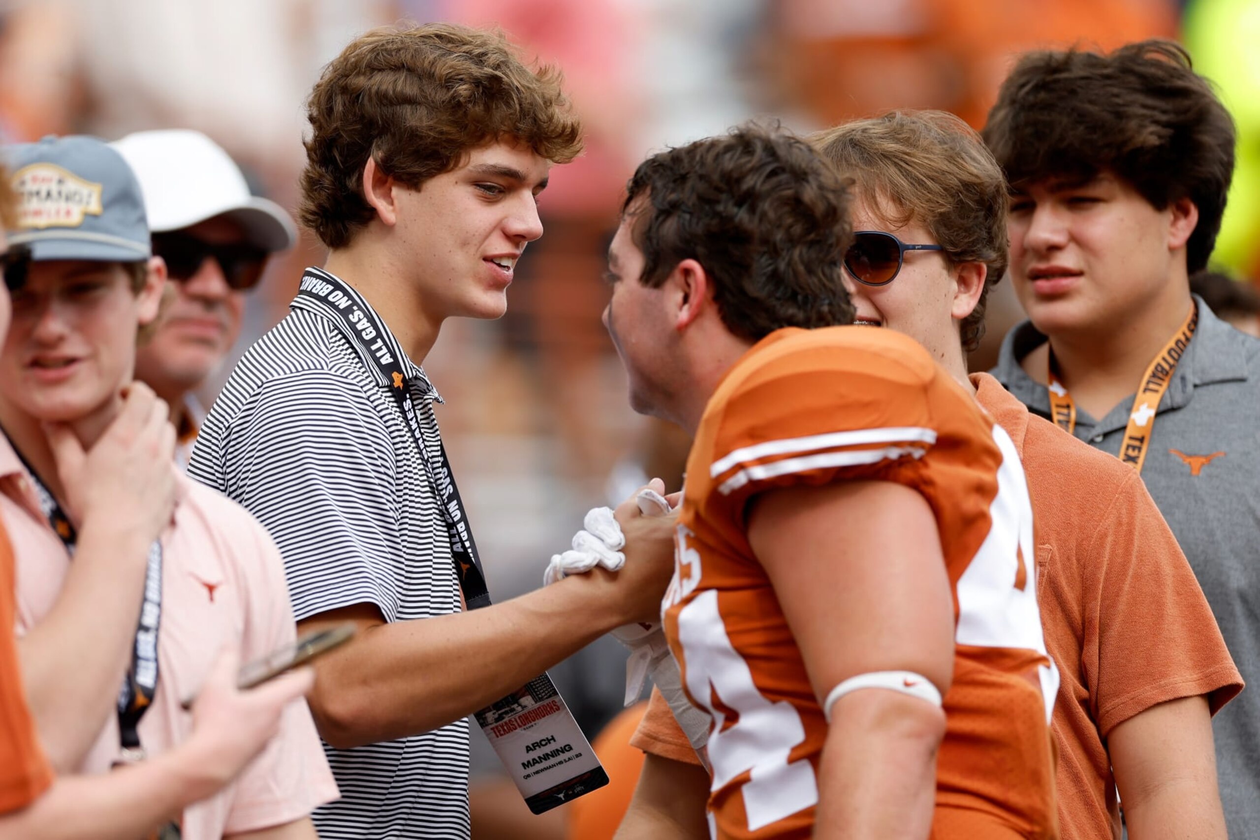 AUSTIN, TEXAS - OCTOBER 15: Arch Manning watches pregame warmups on the sideline before the game between the Texas Longhorns and the Iowa State Cyclones at Darrell K Royal-Texas Memorial Stadium on October 15, 2022 in Austin, Texas. (Photo by Tim Warner/Getty Images)