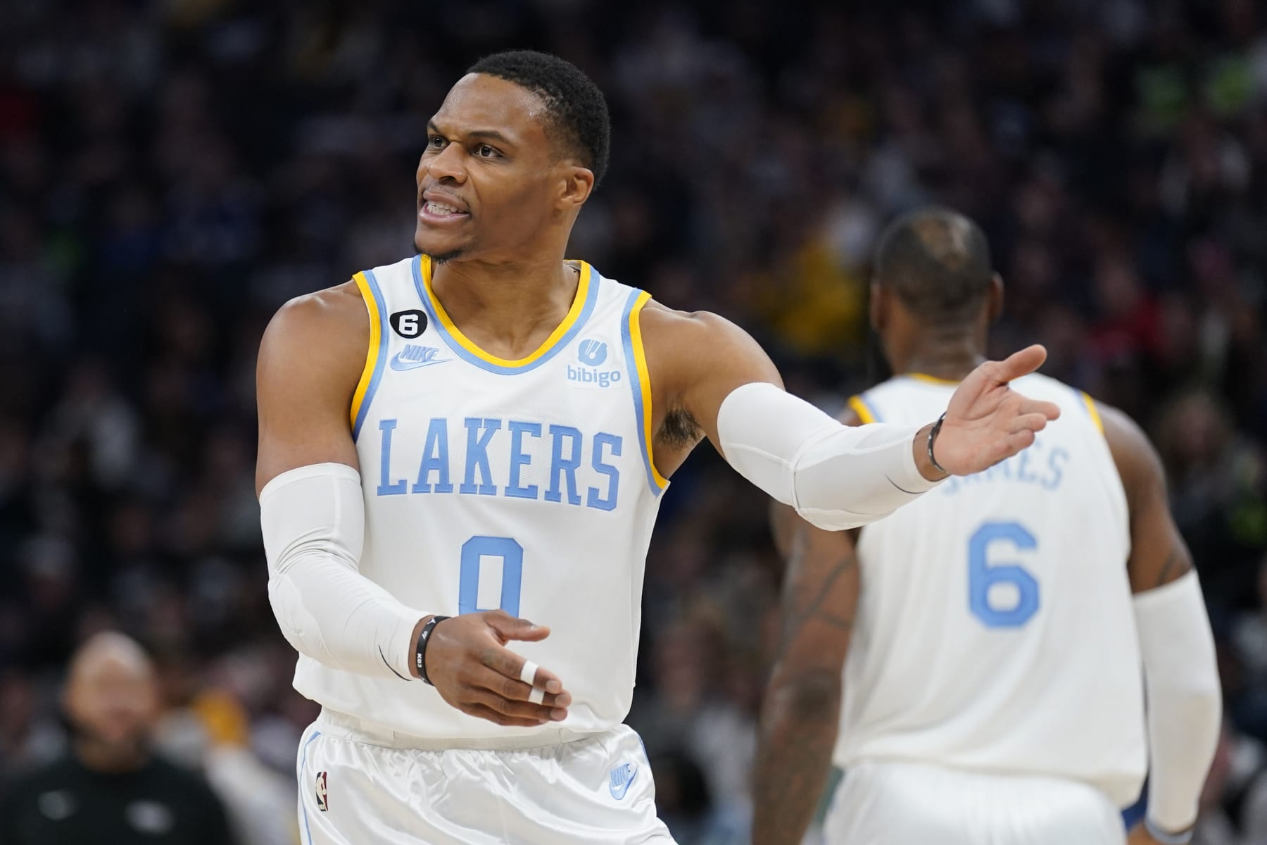 Los Angeles Lakers guard Russell Westbrook (0), left, reacts towards a referee during the first half of an NBA basketball game against the Minnesota Timberwolves, Friday, Oct. 28, 2022, in Minneapolis. (AP Photo/Abbie Parr)