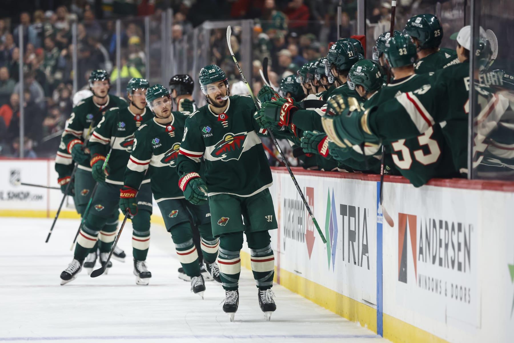 ST PAUL, MN - OCTOBER 06: Frederick Gaudreau #89 of the Minnesota Wild skates by the Wild bench to celebrate his goal with teammates against the Chicago Blackhawks with teammates in the first period of a preseason game at Xcel Energy Center on October 6, 2022 in St Paul, Minnesota. (Photo by David Berding/Getty Images)