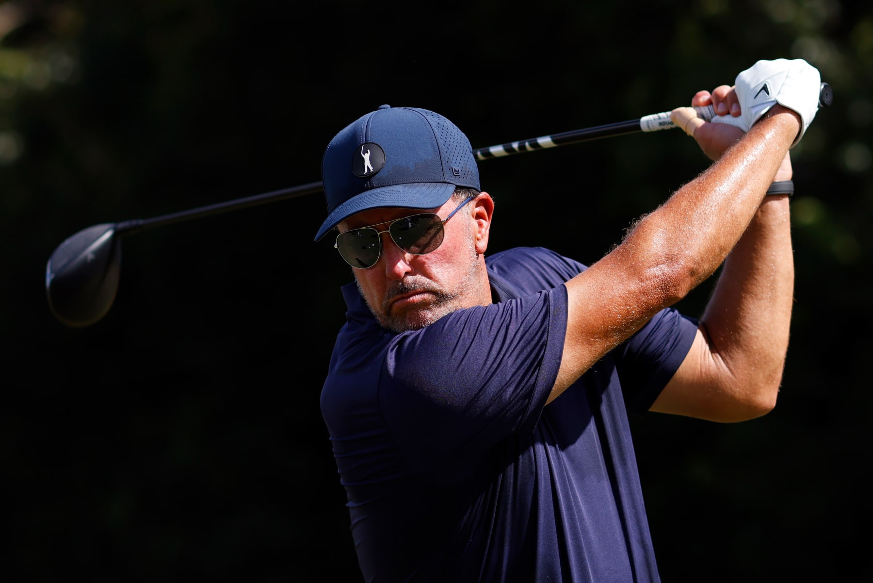 DORAL, FLORIDA - OCTOBER 28: Team Captain Phil Mickelson of Hy Flyers GC plays a shot on the driving range during the quarterfinals of the LIV Golf Invitational - Miami at Trump National Doral Miami on October 28, 2022 in Doral, Florida. (Photo by Chris Trotman/LIV Golf via Getty Images)
