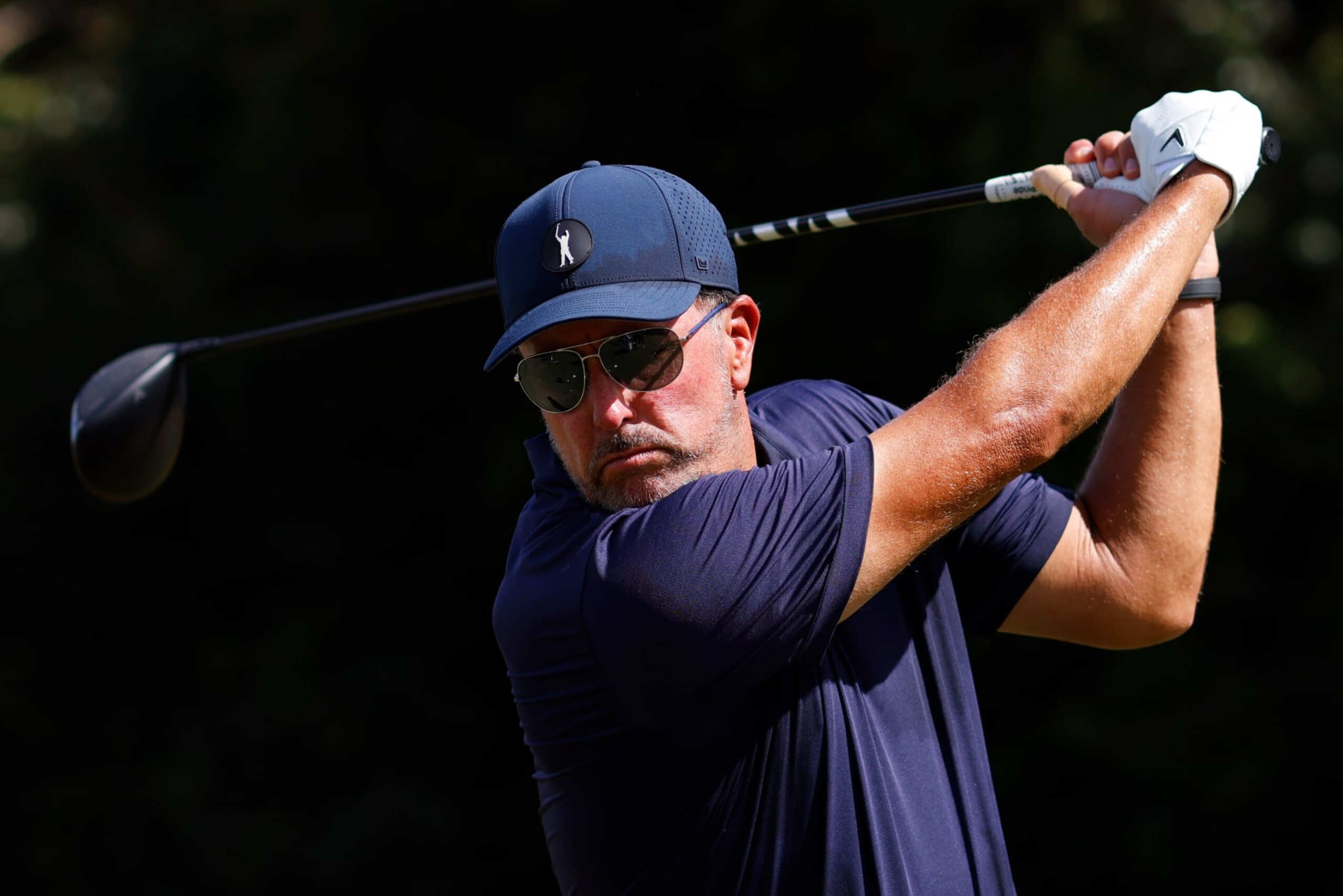 DORAL, FLORIDA - OCTOBER 28: Team Captain Phil Mickelson of Hy Flyers GC plays a shot on the driving range during the quarterfinals of the LIV Golf Invitational - Miami at Trump National Doral Miami on October 28, 2022 in Doral, Florida. (Photo by Chris Trotman/LIV Golf via Getty Images)