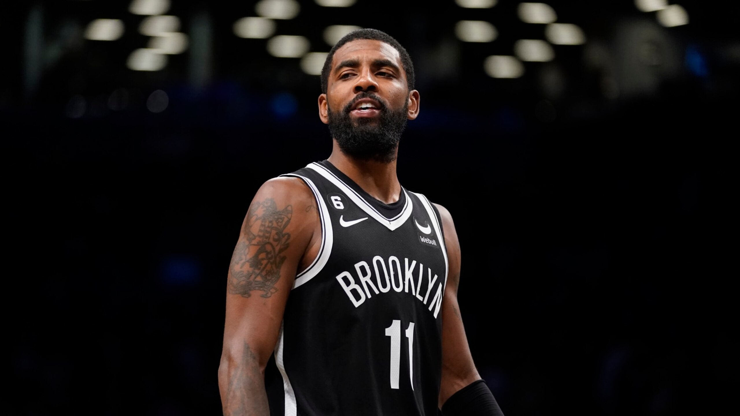 Brooklyn Nets guard Kyrie Irving (11) reacts during overtime of an NBA basketball game against the Dallas Mavericks, Thursday, Oct. 27, 2022, in New York. (AP Photo/John Minchillo)