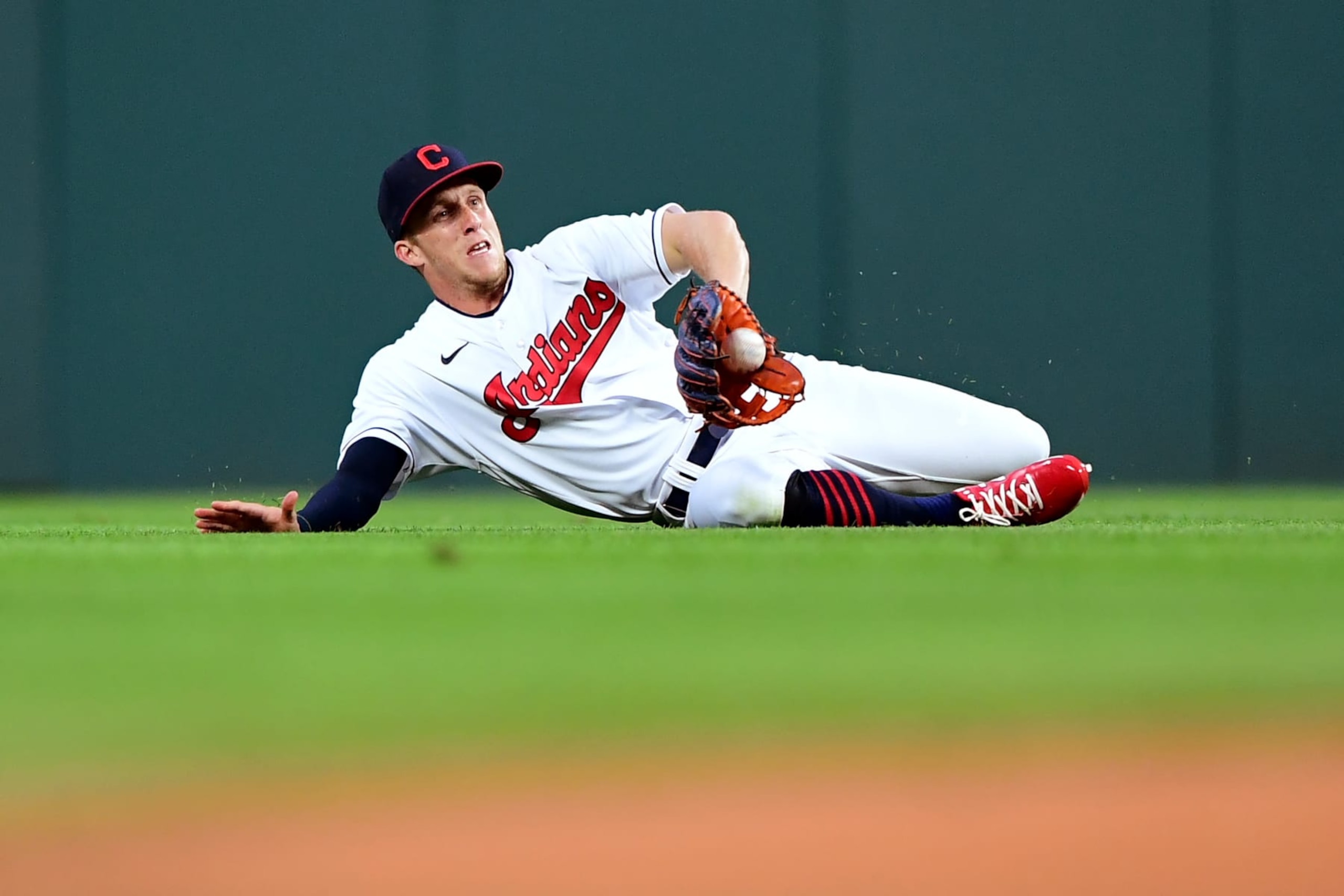 CLEVELAND, OHIO - AUGUST 07: Myles Straw #7 of the Cleveland Indians slides to make a catch in the second inning during their game against the Detroit Tigers at Progressive Field on August 7, 2021 in Cleveland, Ohio. (Photo by Emilee Chinn/Getty Images)