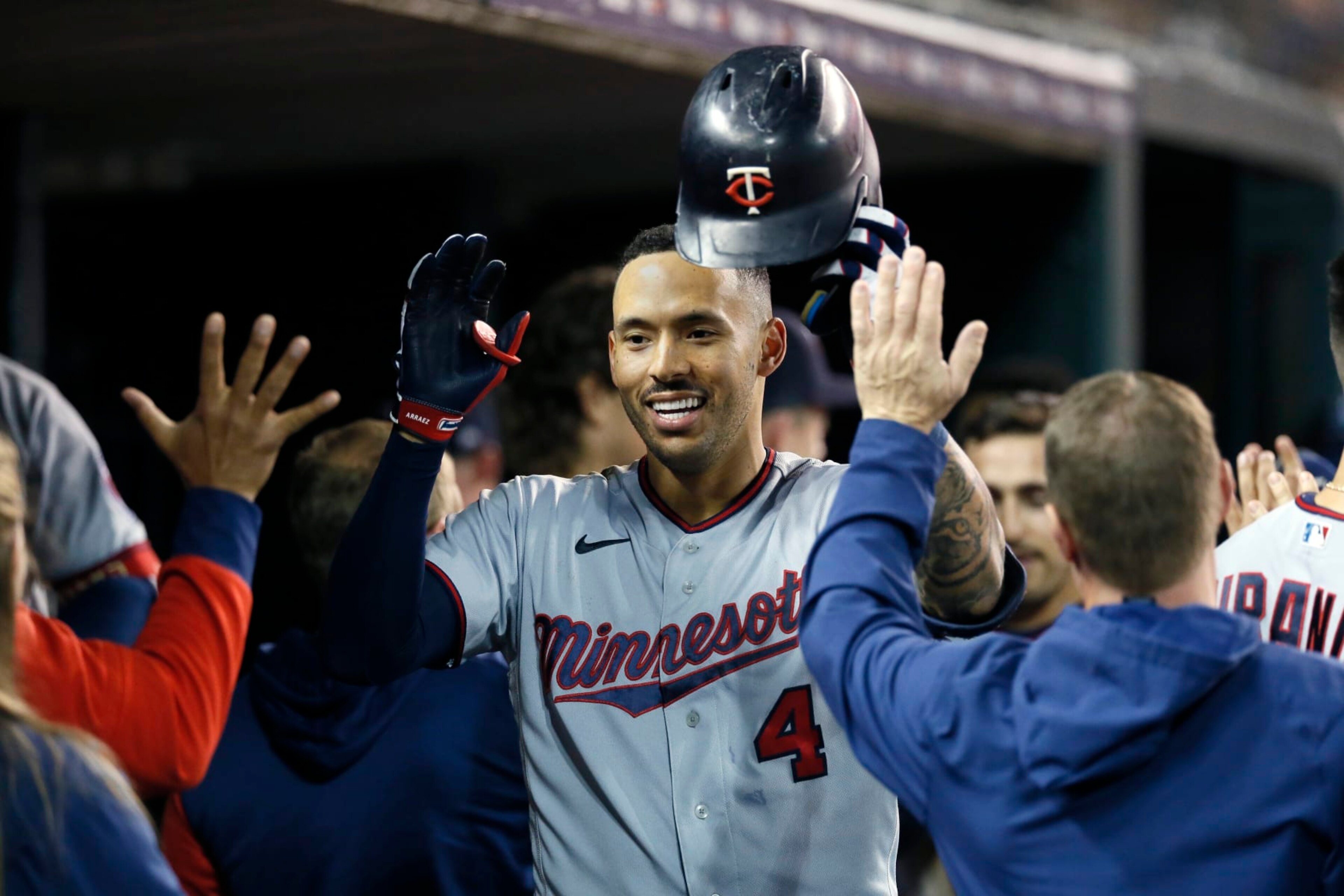 DETROIT, MI - SEPTEMBER 30: Carlos Correa #4 of the Minnesota Twins celebrates with teammates in the dugout after hitting a two-run home run against the Detroit Tigers during the seventh inning at Comerica Park on September 30, 2022, in Detroit, Michigan. (Photo by Duane Burleson/Getty Images) DETROIT, MI - SEPTEMBER 30: Carlos Correa #4 of the Minnesota Twins celebrates with teammates in the dugout after hitting a two-run home run against the Detroit Tigers during the seventh inning at Comerica Park on September 30, 2022, in Detroit, Michigan. (Photo by Duane Burleson/Getty Images)