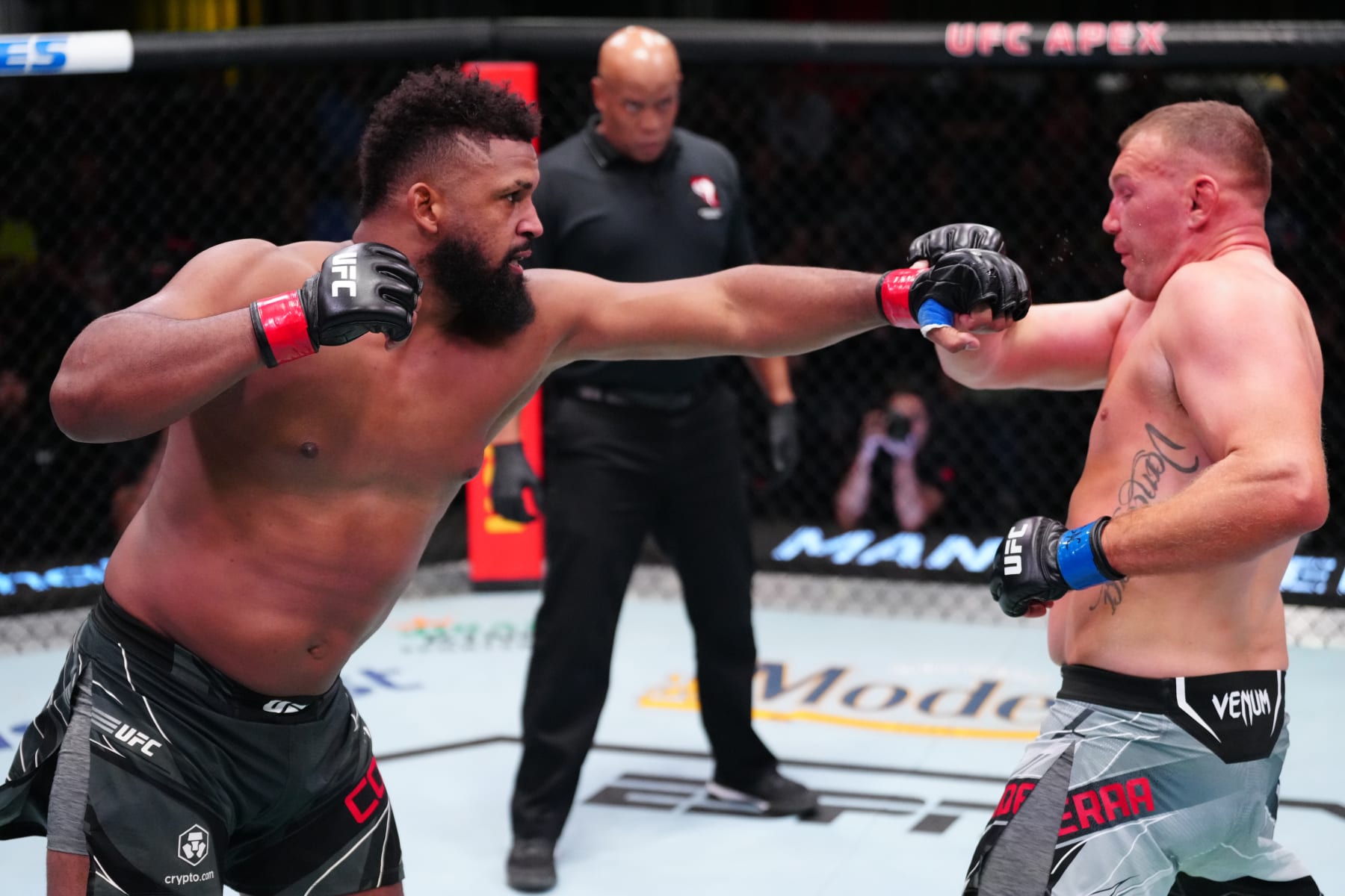 Waldo Cortes Acosta punches Jared Vanderaa. 