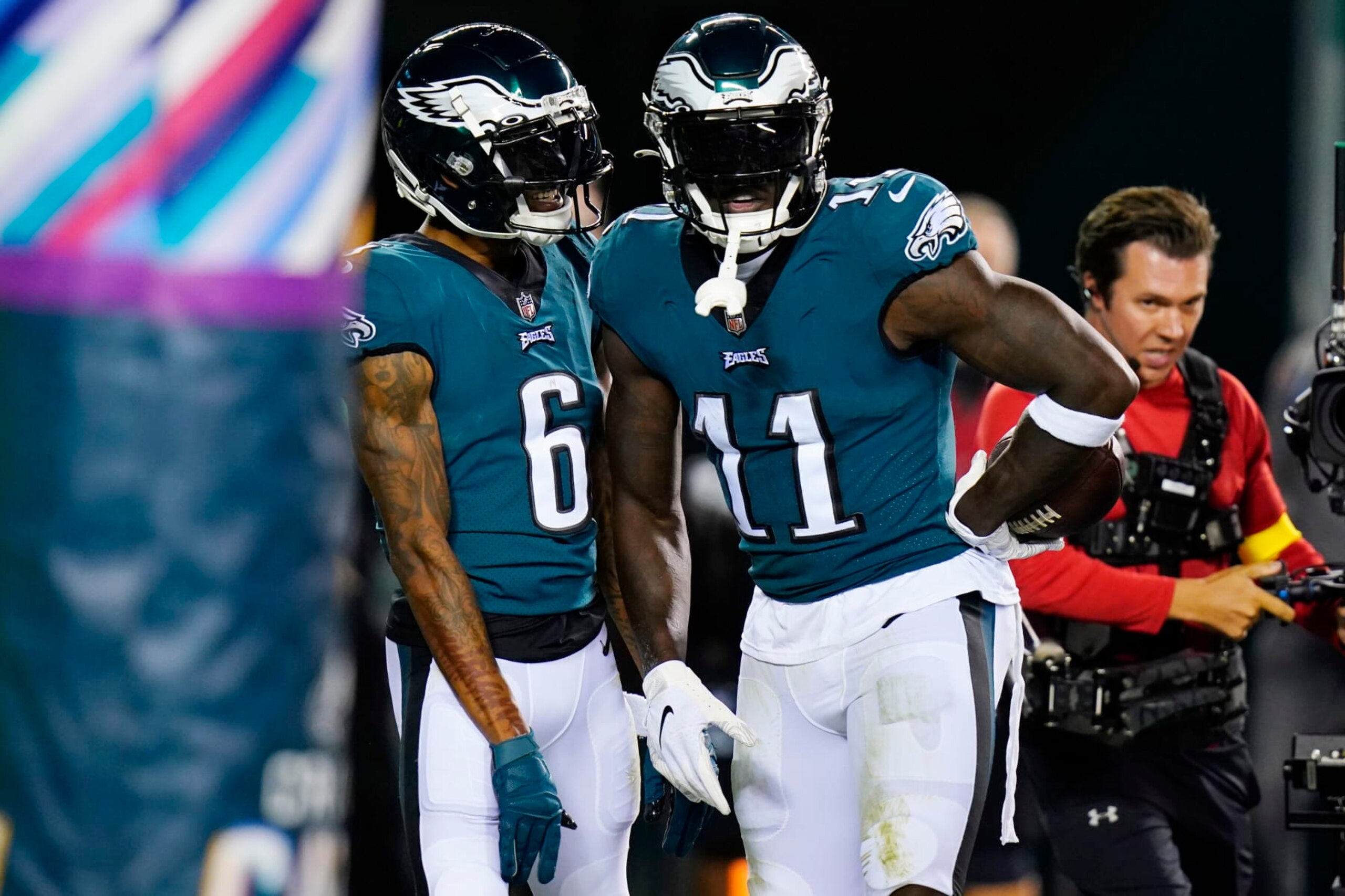 Philadelphia Eagles' A.J. Brown, right, and Philadelphia Eagles' DeVonta Smith celebrate Brown's touchdown during the first half of an NFL football game against the Dallas Cowboys on Sunday, Oct. 16, 2022, in Philadelphia. (AP Photo/Chris Szagola)
