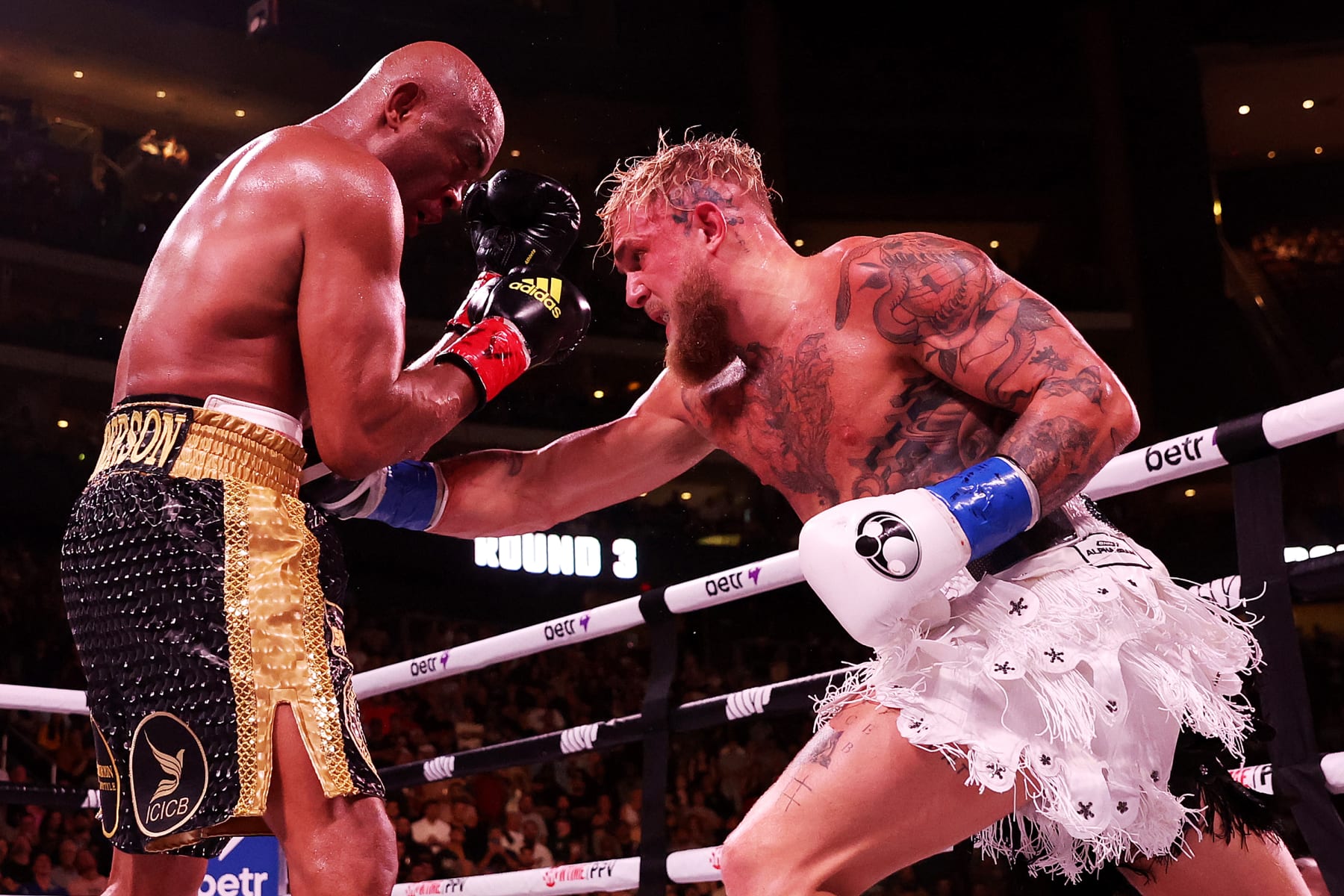 GLENDALE, ARIZONA - OCTOBER 29: Jake Paul (R) punches Anderson Silva of Brazil during their cruiserweight bout at Gila River Arena on October 29, 2022 in Glendale, Arizona. (Photo by Christian Petersen/Getty Images)