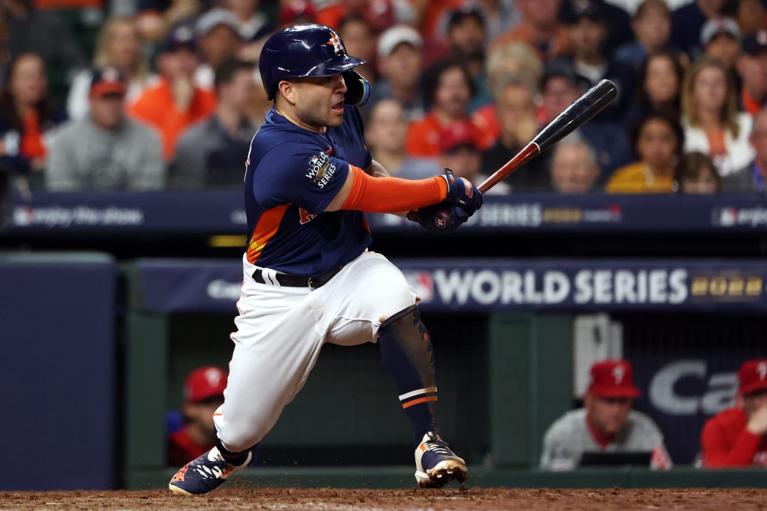 HOUSTON, TX - OCTOBER 29:  Jose Altuve #27 of the Houston Astros  hits a single in the fifth inning during Game 2 of the 2022 World Series between the Philadelphia Phillies and the Houston Astros at Minute Maid Park on Saturday, October 29, 2022 in Houston, Texas. (Photo by Mary DeCicco/MLB Photos via Getty Images)
