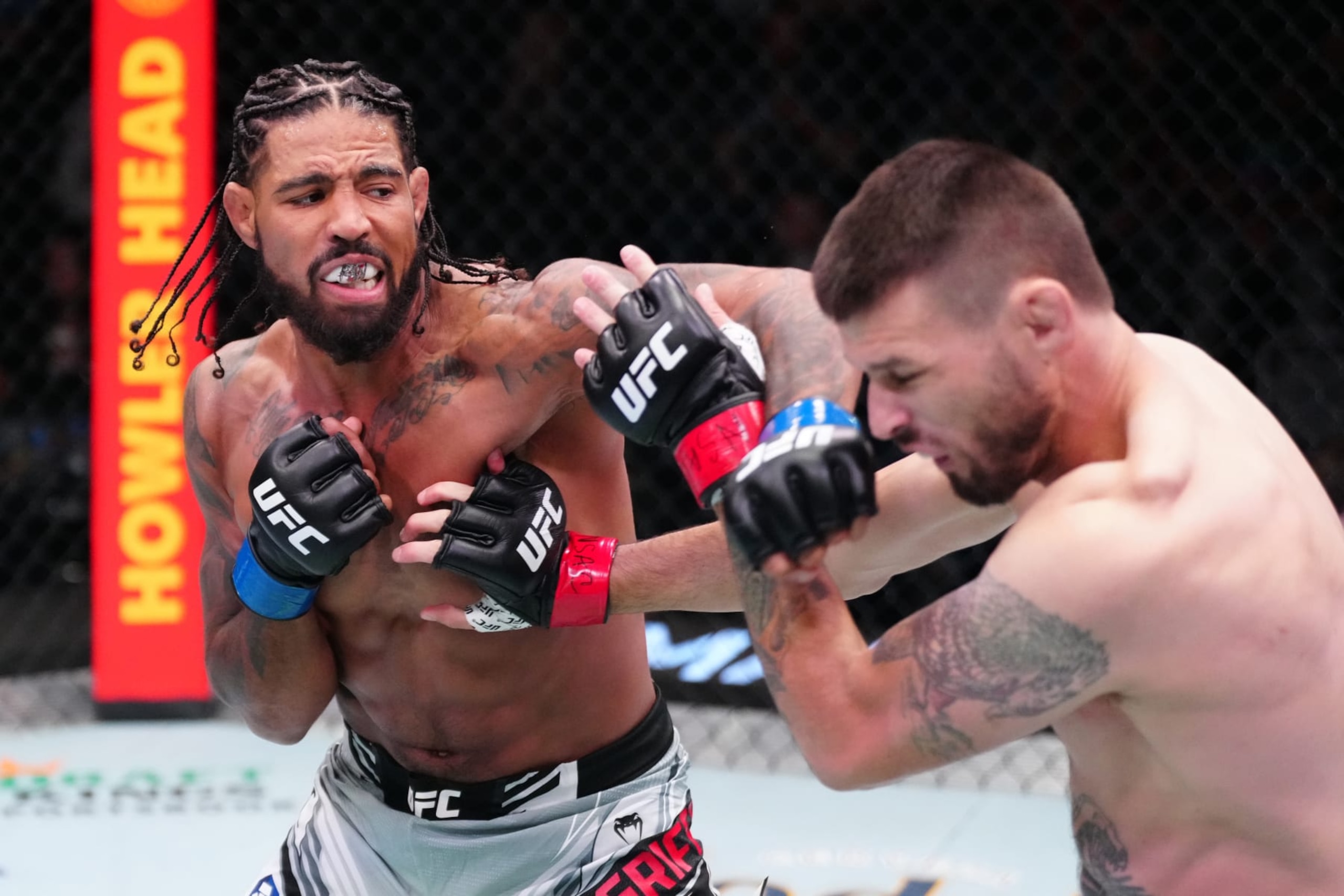 LAS VEGAS, NEVADA - OCTOBER 29:  (L-R) Max Griffin punches Tim Means in a welterweight fight during the UFC Fight Night event at UFC APEX on October 29, 2022 in Las Vegas, Nevada. (Photo by Jeff Bottari/Zuffa LLC)