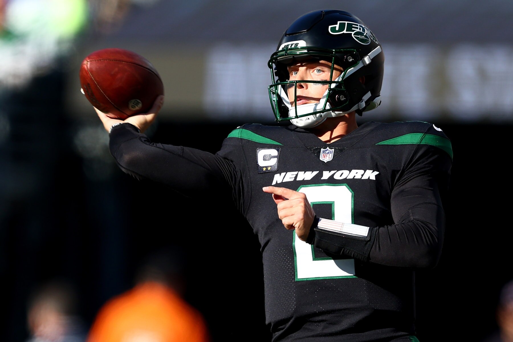 EAST RUTHERFORD, NEW JERSEY - OCTOBER 30: Zach Wilson #2 of the New York Jets throws the ball during the first half against the New England Patriots at MetLife Stadium on October 30, 2022 in East Rutherford, New Jersey. (Photo by Elsa/Getty Images)