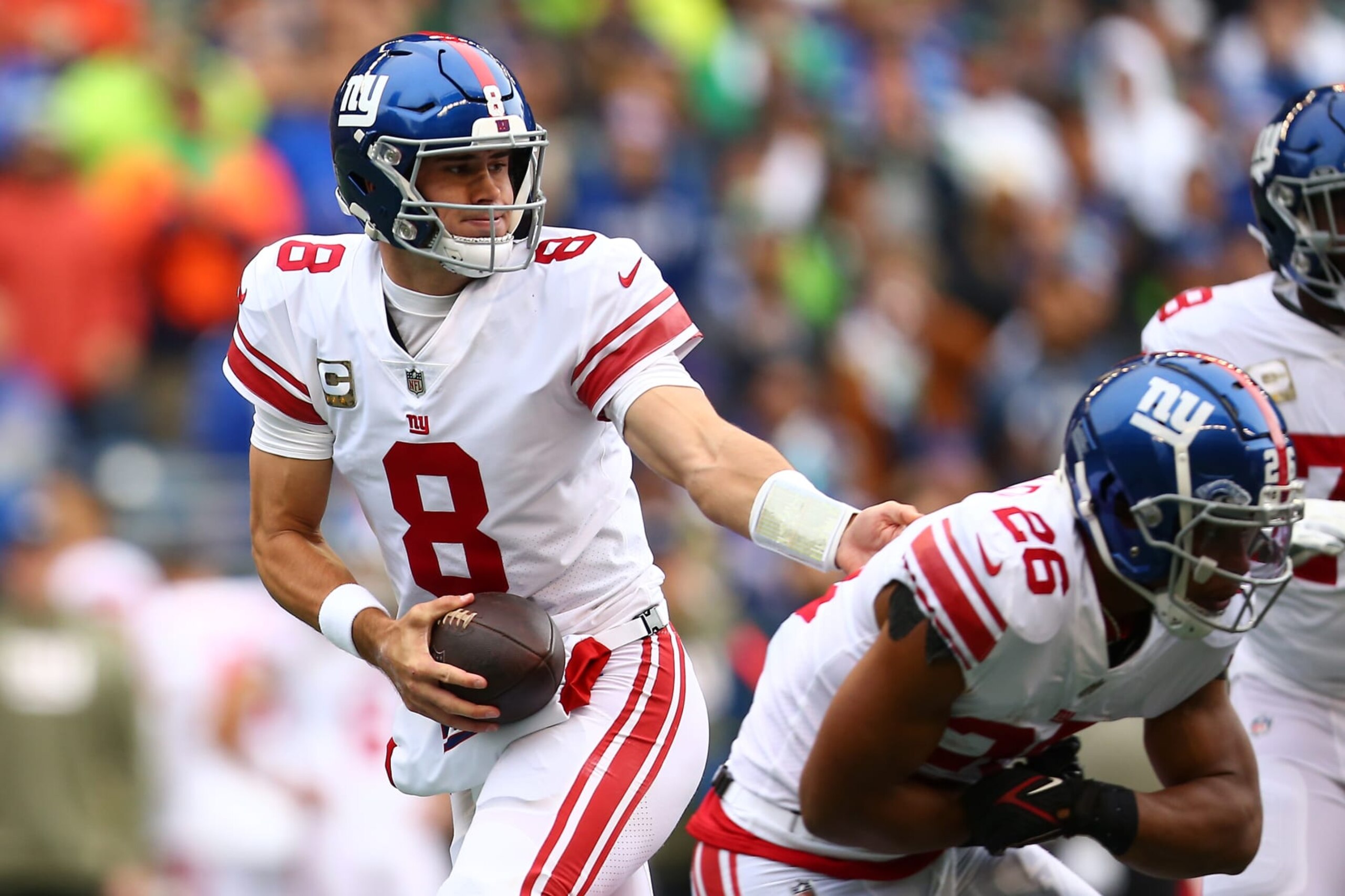 SEATTLE, WASHINGTON - OCTOBER 30: Daniel Jones #8 of the New York Giants drops back against the Seattle Seahawks during the first half at Lumen Field on October 30, 2022 in Seattle, Washington. (Photo by Lindsey Wasson/Getty Images)