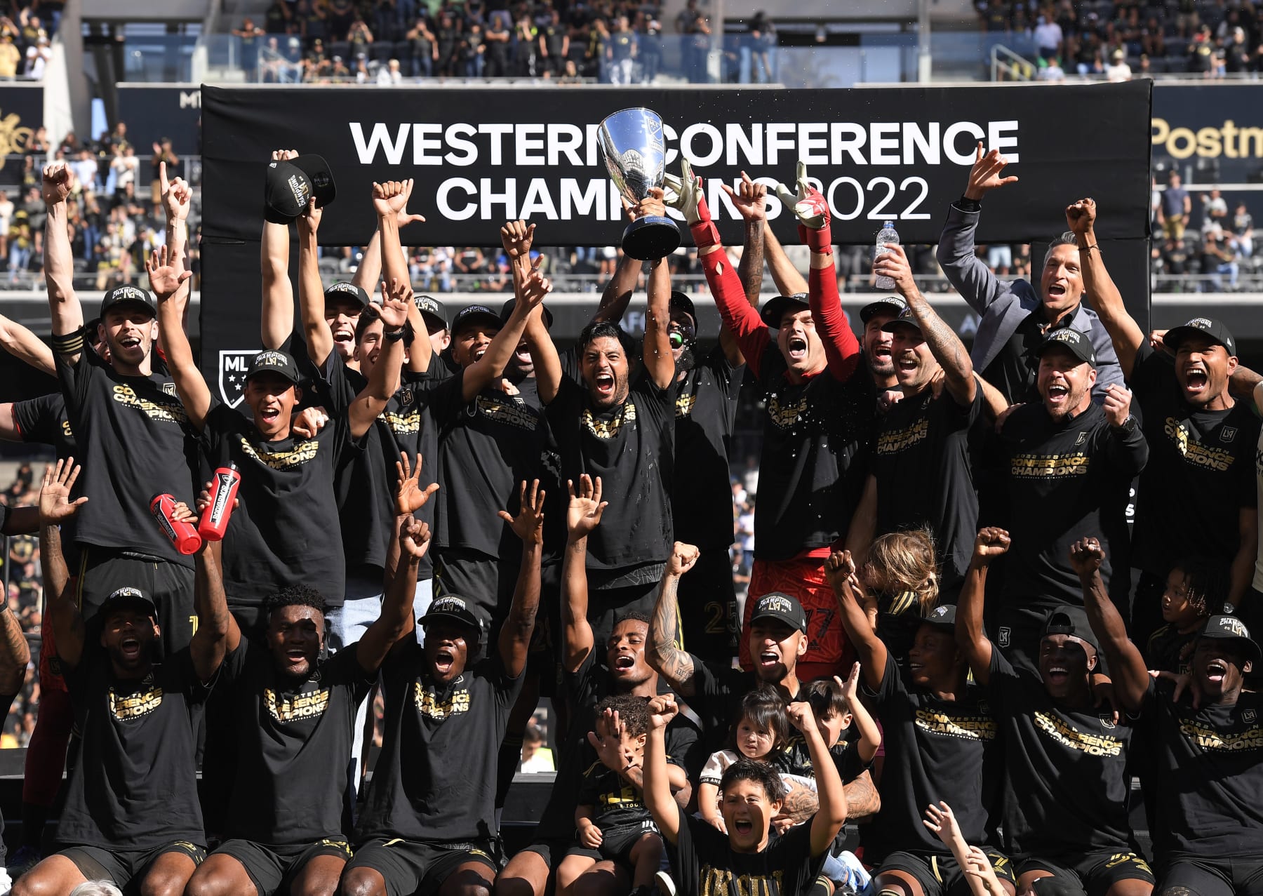 LOS ANGELES, CA - OCTOBER 30: Carlos Vela #10 of Los Angeles FC holds the championship trophy as he celebrates with teammates after defeating Austin FC, 3-0, during the Western Conference Finals of the 2022 MLS Cup Playoffs at Banc of California Stadium on October 30, 2022 in Los Angeles, California. (Photo by Kevork Djansezian/Getty Images)