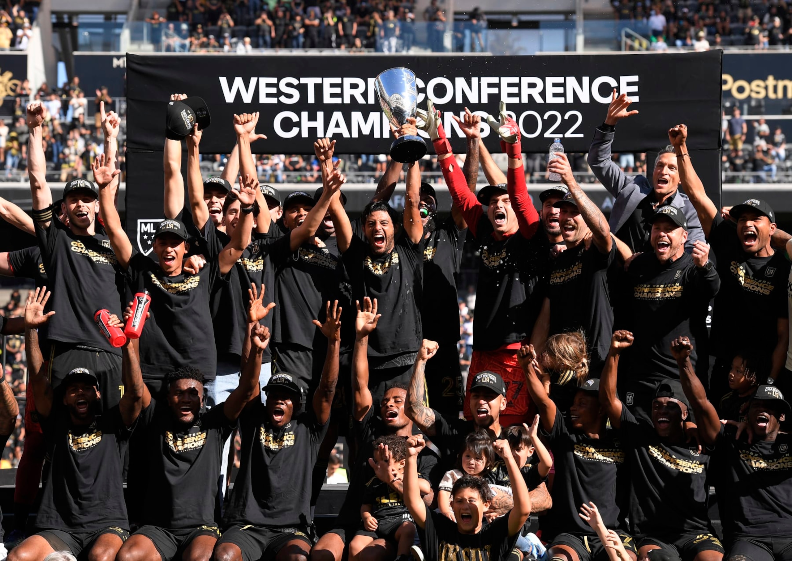 LOS ANGELES, CA - OCTOBER 30: Carlos Vela #10 of Los Angeles FC holds the championship trophy as he celebrates with teammates after defeating Austin FC, 3-0, during the Western Conference Finals of the 2022 MLS Cup Playoffs at Banc of California Stadium on October 30, 2022 in Los Angeles, California. (Photo by Kevork Djansezian/Getty Images) LOS ANGELES, CA - OCTOBER 30: Carlos Vela #10 of Los Angeles FC holds the championship trophy as he celebrates with teammates after defeating Austin FC, 3-0, during the Western Conference Finals of the 2022 MLS Cup Playoffs at Banc of California Stadium on October 30, 2022 in Los Angeles, California. (Photo by Kevork Djansezian/Getty Images)