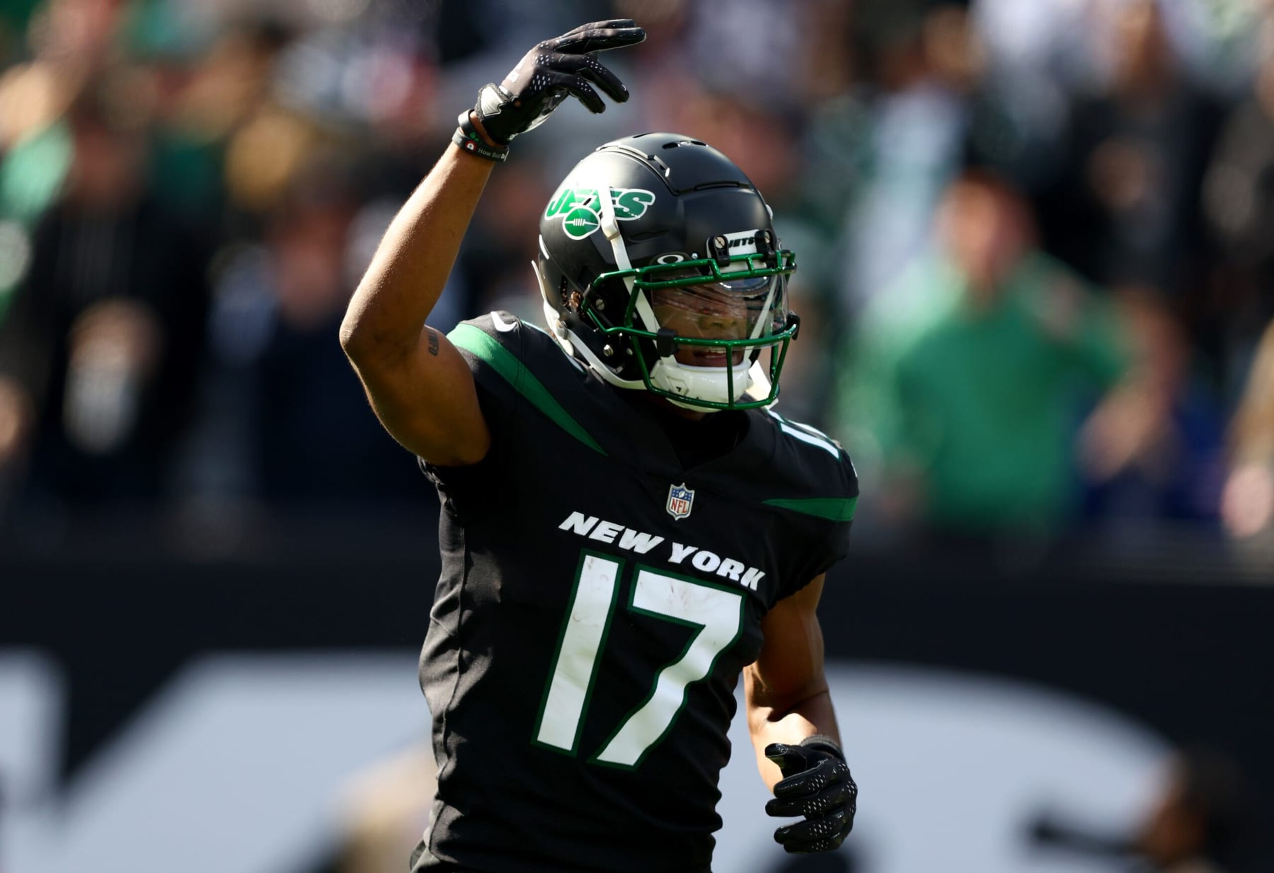 EAST RUTHERFORD, NEW JERSEY - OCTOBER 30: Garrett Wilson #17 of the New York Jets celebrates a reception for a first down during the first quarter against the New England Patriots at MetLife Stadium on October 30, 2022 in East Rutherford, New Jersey. (Photo by Elsa/Getty Images)