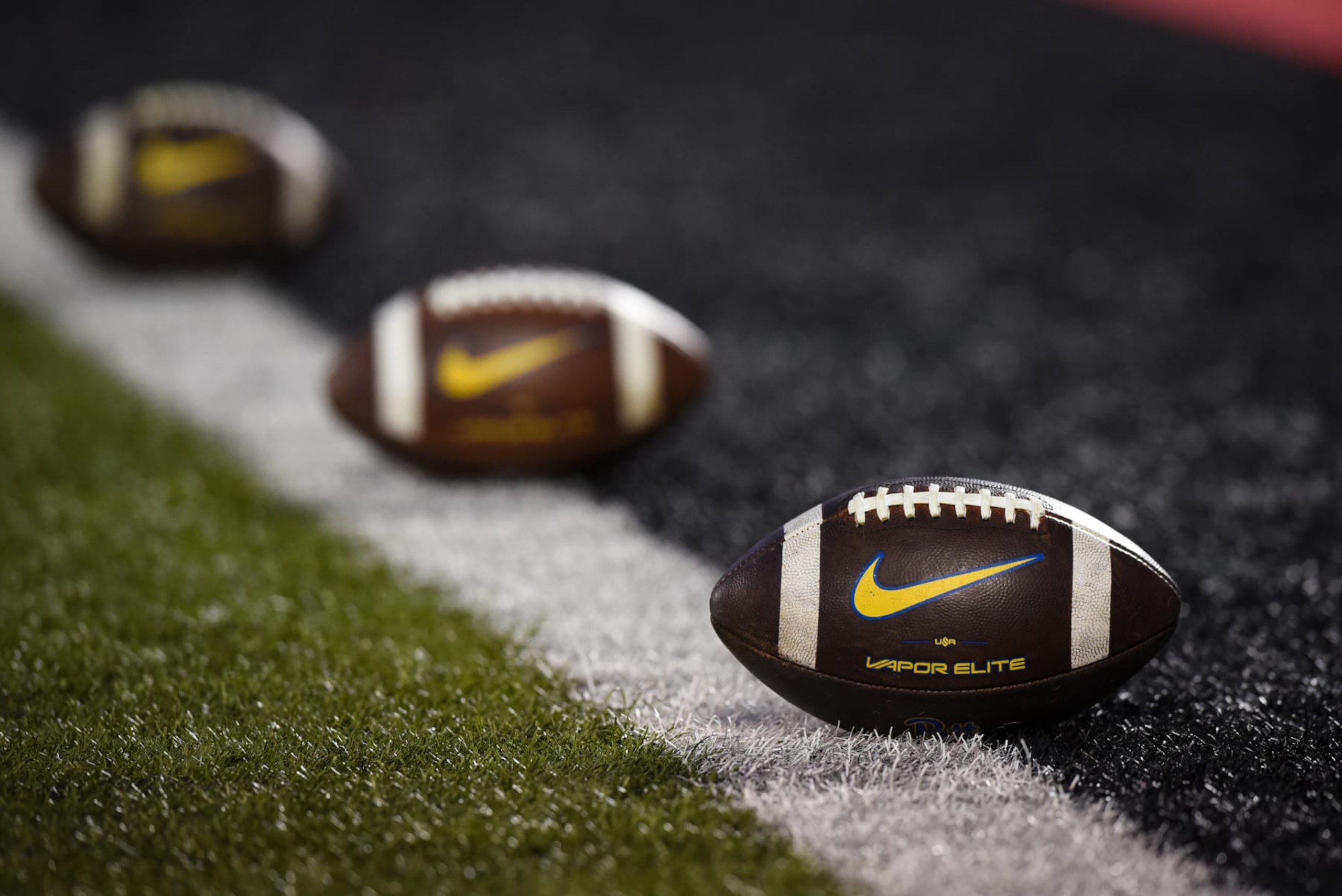 LOUISVILLE, KY - OCTOBER 22: Nike Vapor Elite footballs sit on the goal line during a college football game between the Pittsburgh Panthers and Louisville Cardinals on October 22, 2022 at Cardinal Stadium in Louisville, Kentucky. (Photo by James Black/Icon Sportswire via Getty Images) LOUISVILLE, KY - OCTOBER 22: Nike Vapor Elite footballs sit on the goal line during a college football game between the Pittsburgh Panthers and Louisville Cardinals on October 22, 2022 at Cardinal Stadium in Louisville, Kentucky. (Photo by James Black/Icon Sportswire via Getty Images)