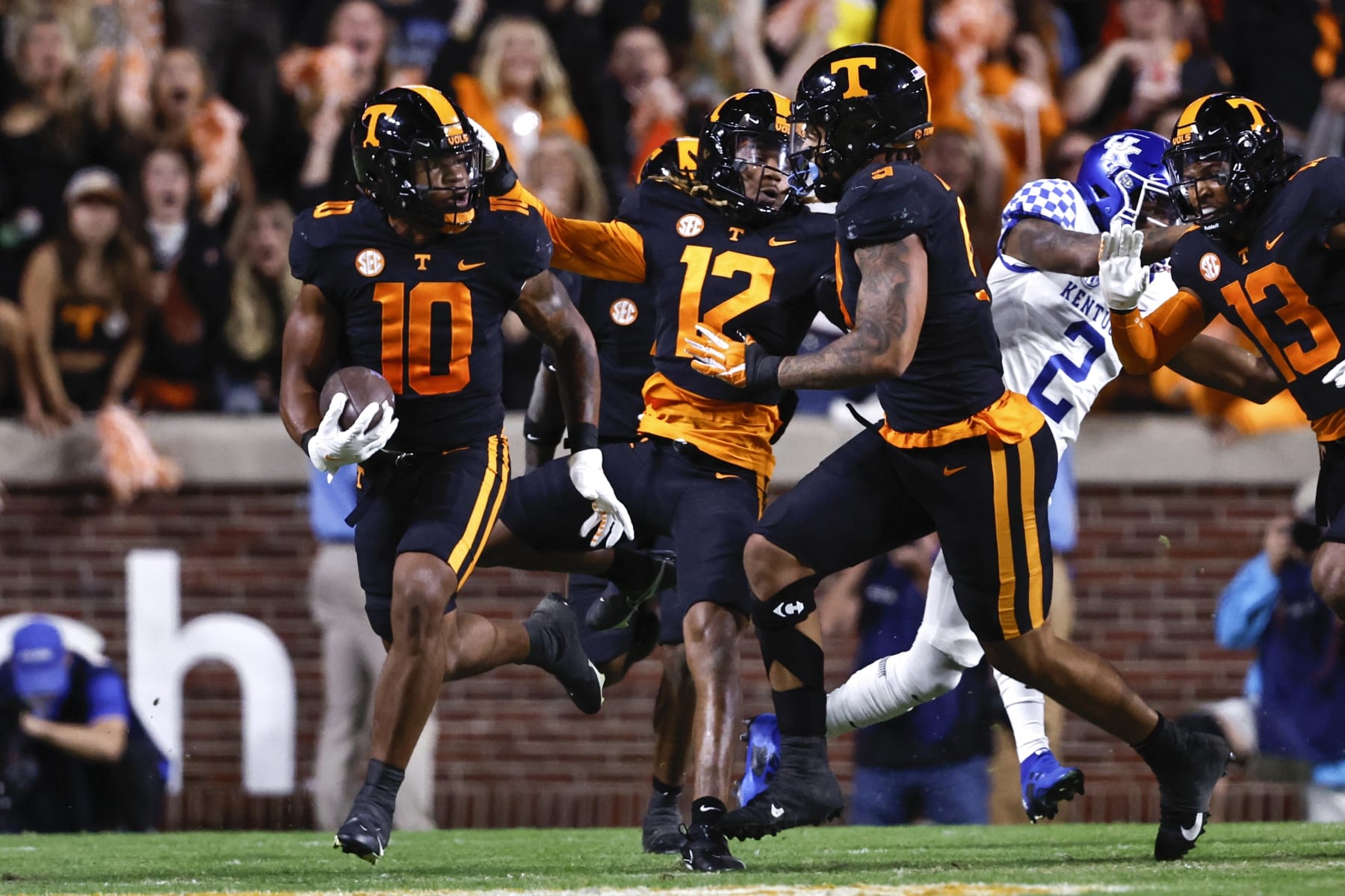 Tennessee linebacker Juwan Mitchell (10) returns an interception during the first half of an NCAA college football game against Kentucky, Saturday, Oct. 29, 2022, in Knoxville, Tenn. (AP Photo/Wade Payne)